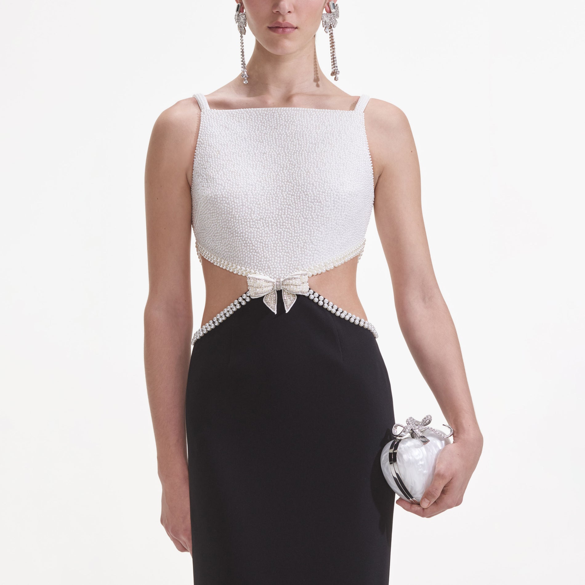 A close up of a woman wearing the Black And White Crepe Maxi Dress