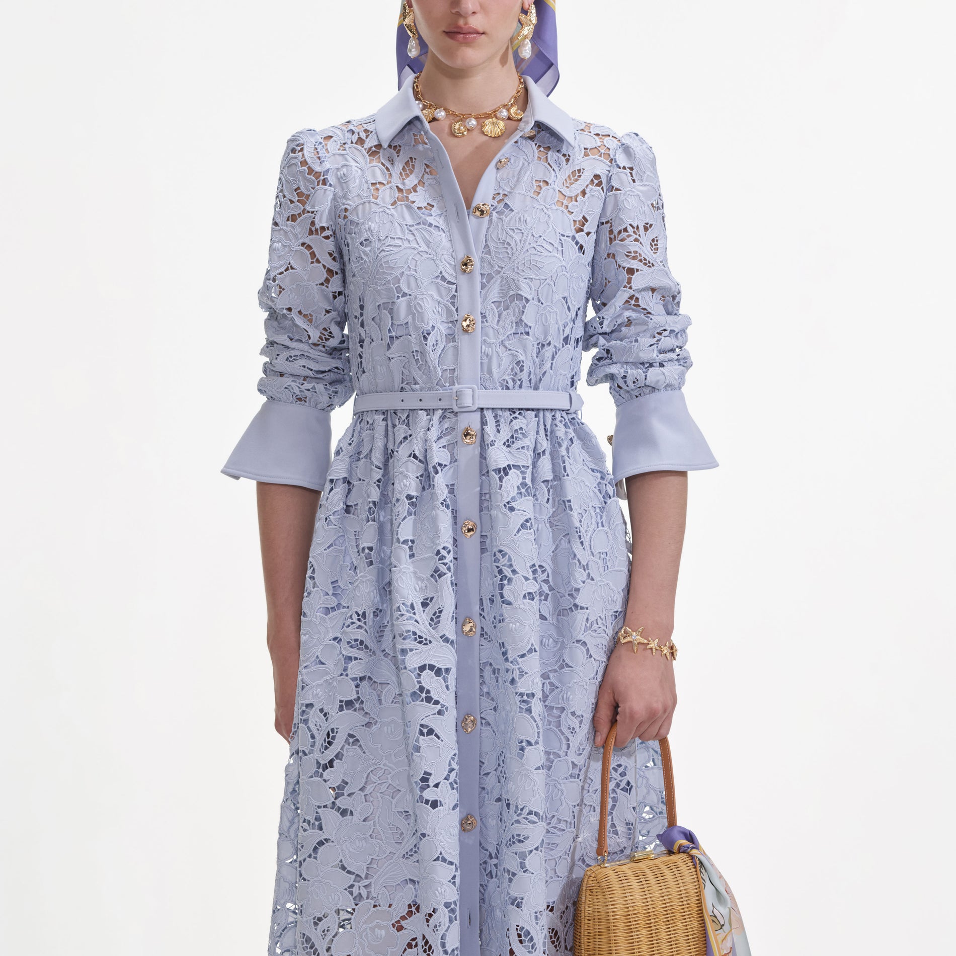 A close up of a woman wearing the Blue Lace Collared Maxi Dress