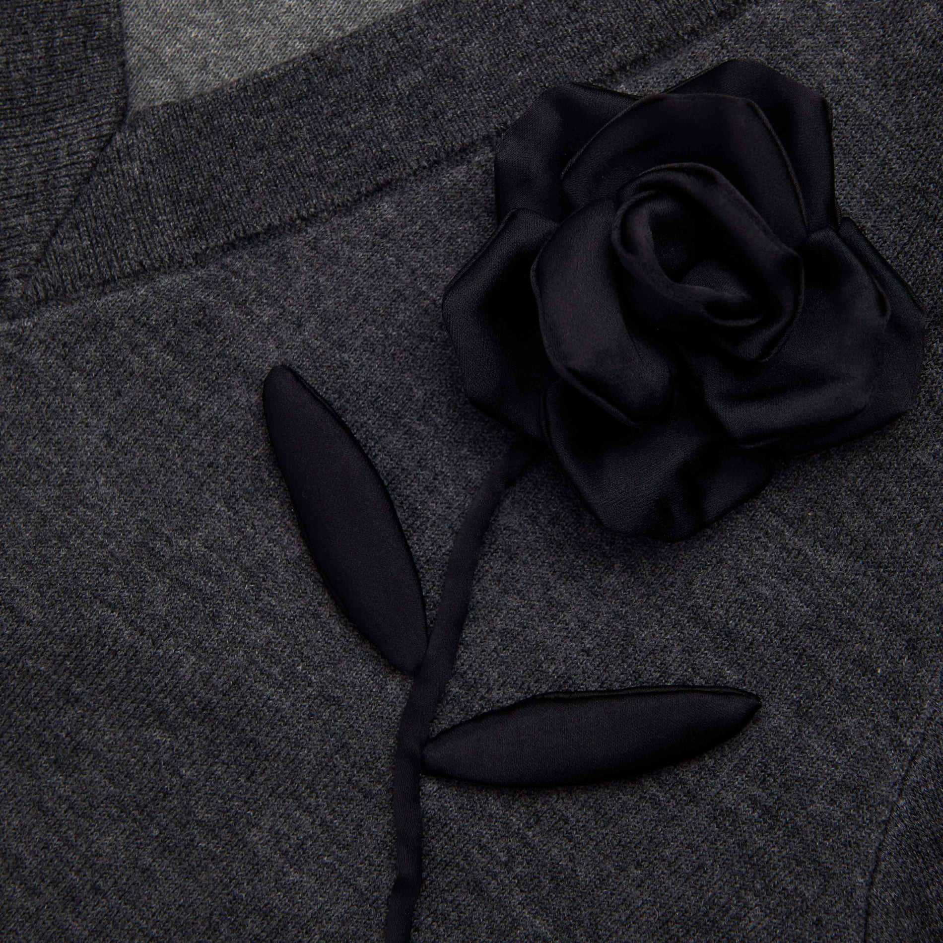 Side view of a woman wearing the Charcoal Black Rose Jumper