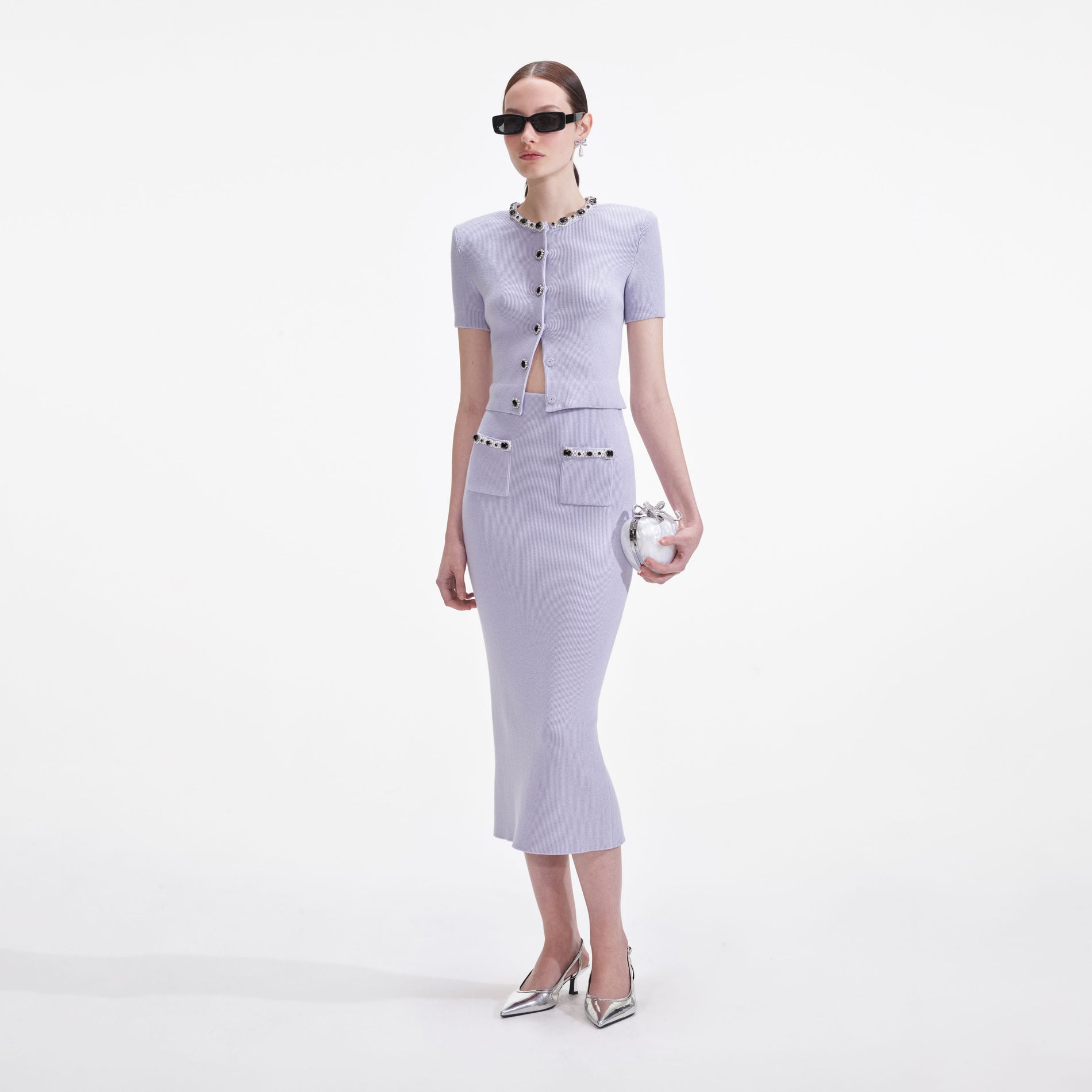 Side view of a woman wearing the Lilac Embellished Knit Midi Skirt