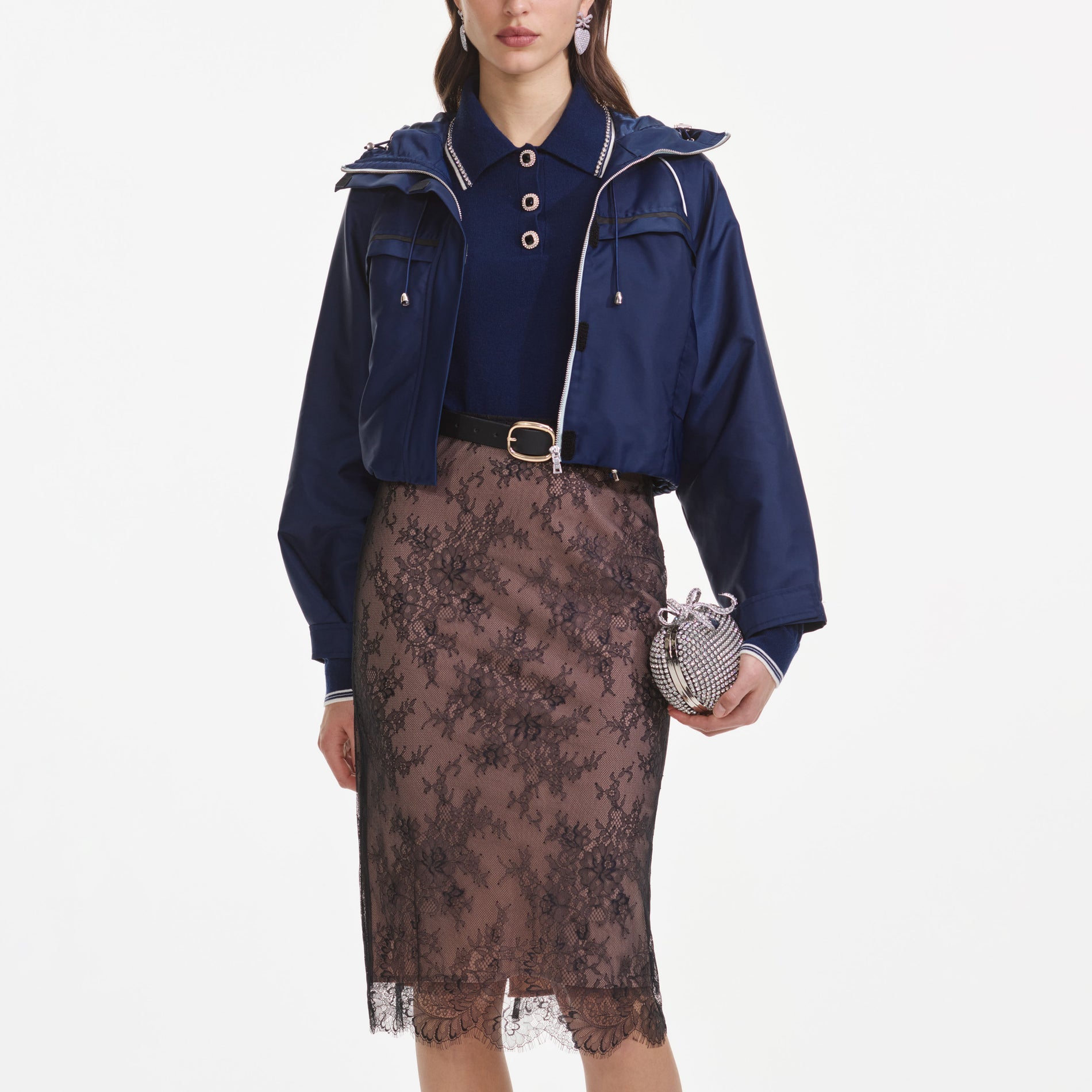 A close up of a woman wearing the Navy Nylon Windbreaker