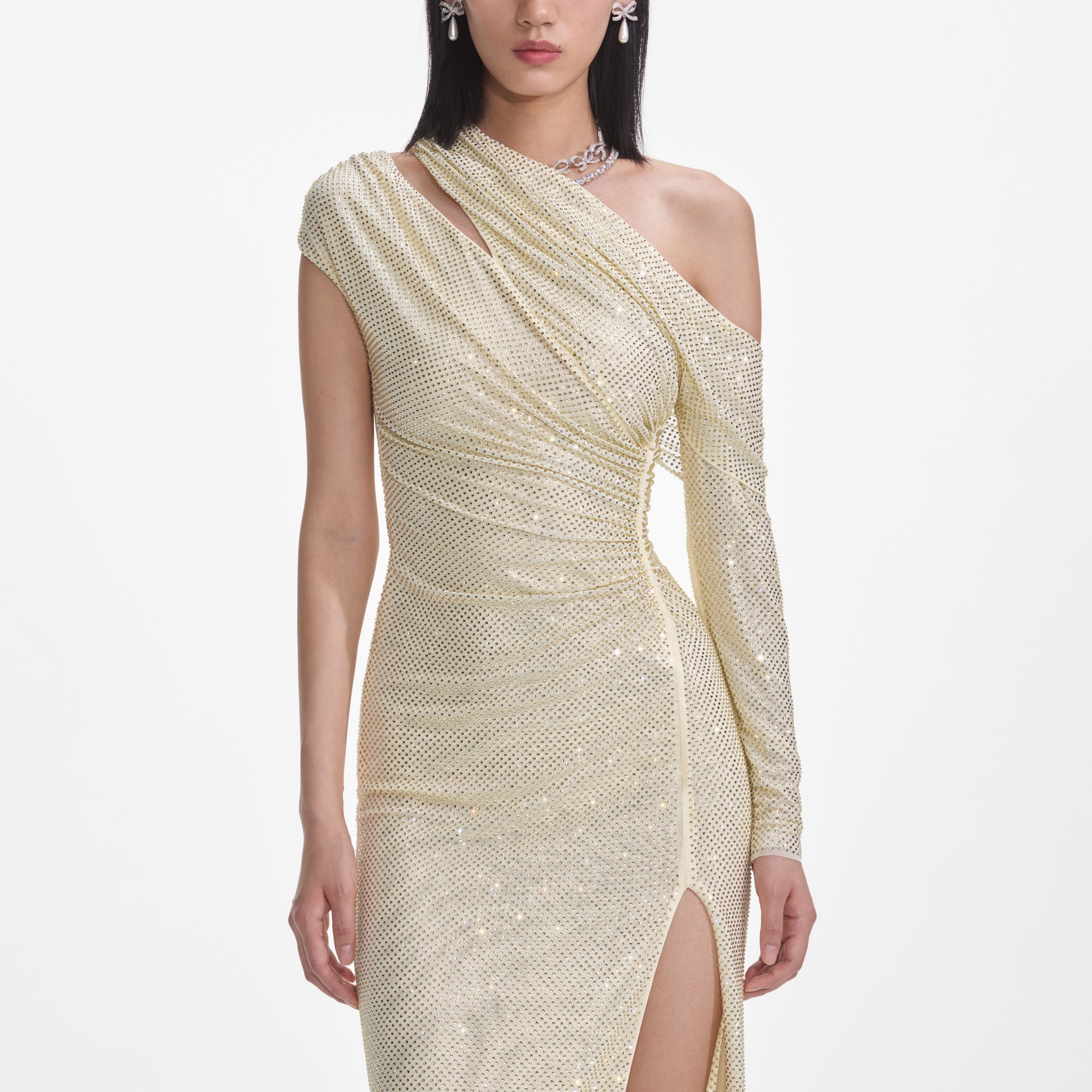 A close up of a woman wearing the Yellow Rhinestone Gathered Midi Dress