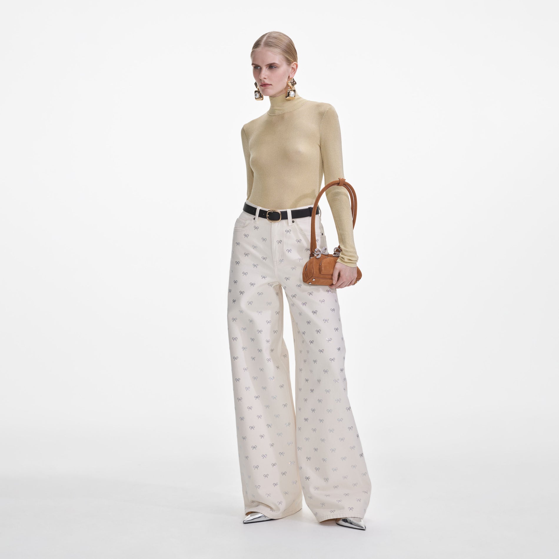 Side view of a woman wearing the Yellow Viscose Knit Top