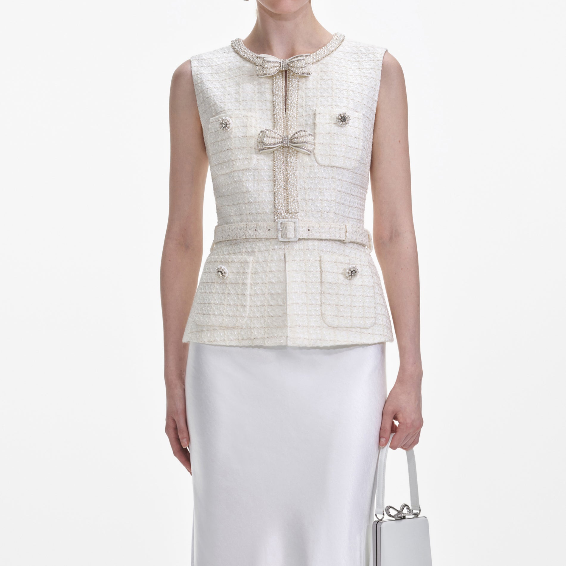 A close up of a woman wearing the Cream Boucle Midi Dress