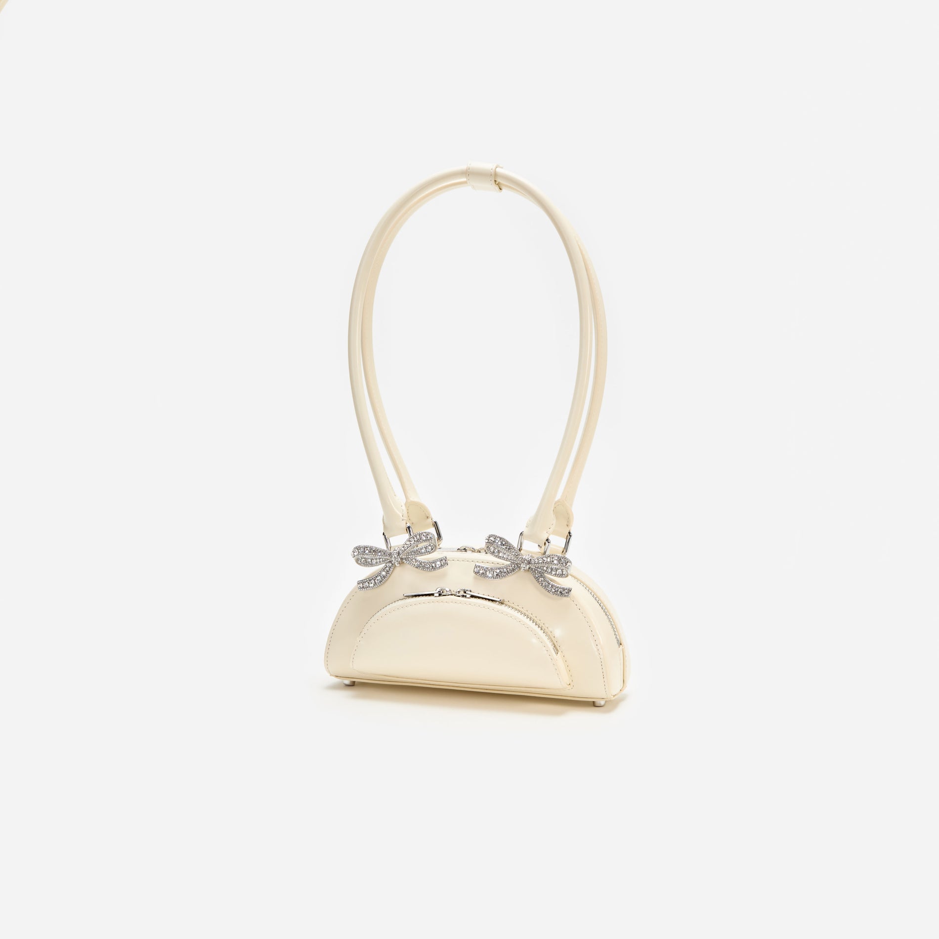A photo of the Cream Leather Curved Mini Shoulder Bag
