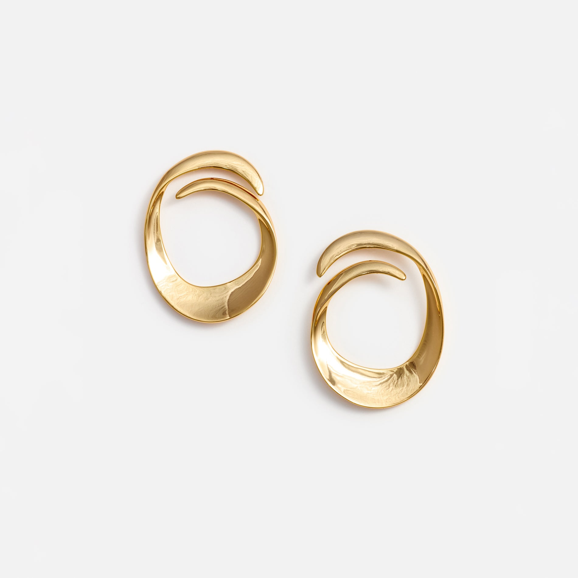 A photo of the Gold Swirl Earrings
