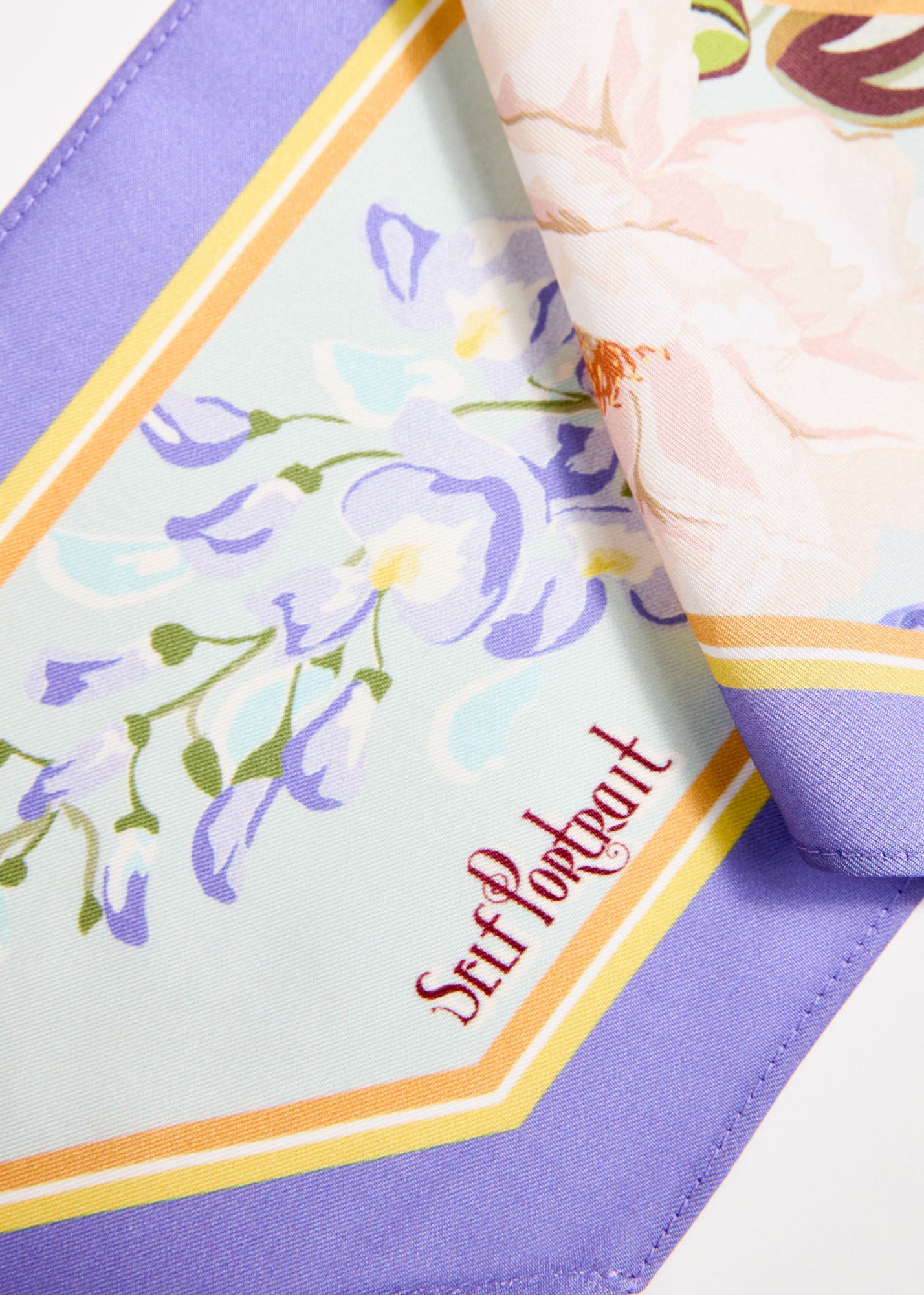 Back view of a woman wearing the Blue Floral Twill Scarf