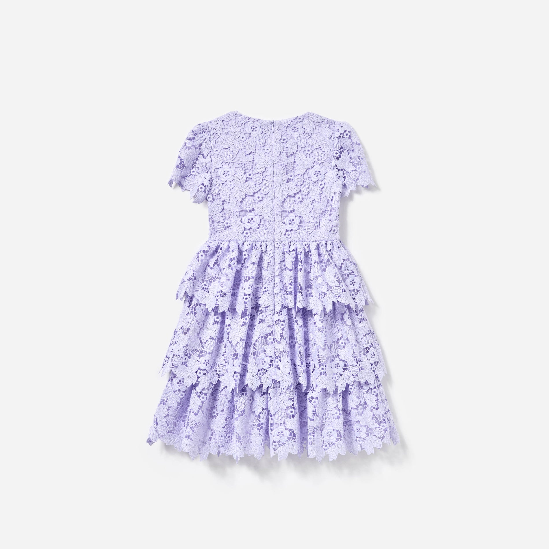 Side view of a woman wearing the Lilac Butterfly Lace Dress
