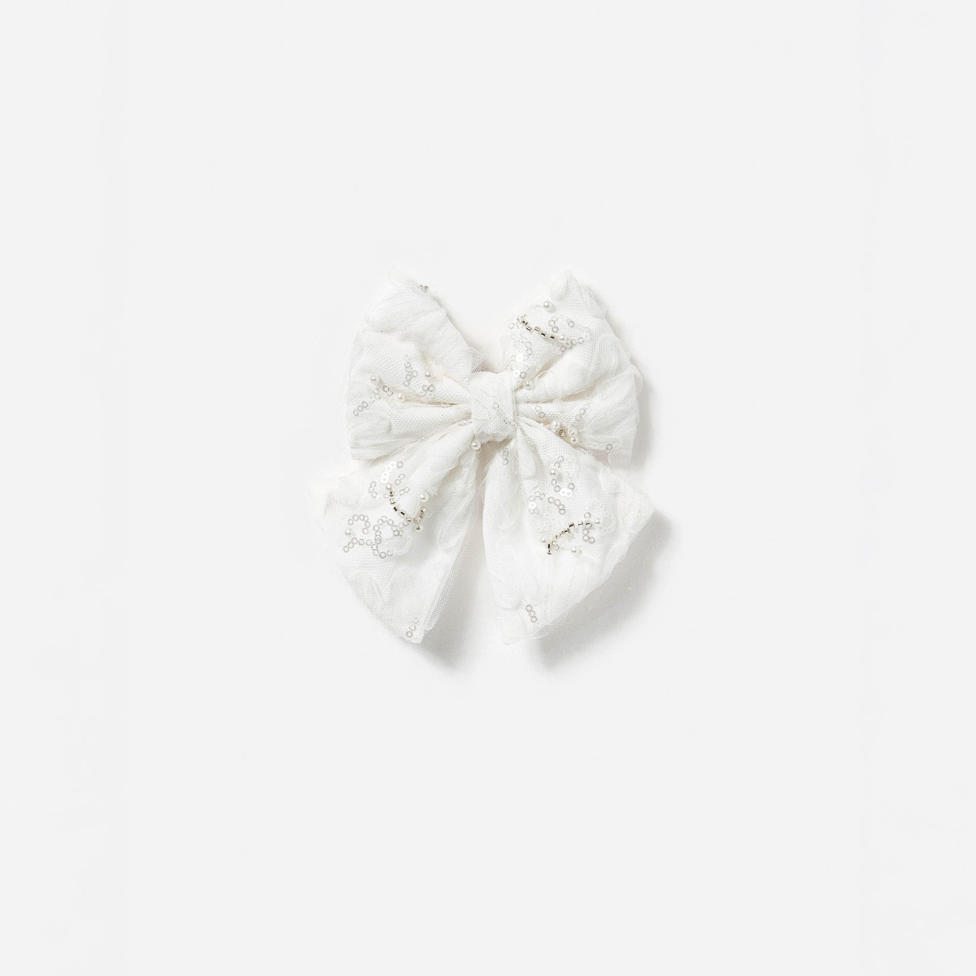 A photo of the Cream Tulle Hair Bow