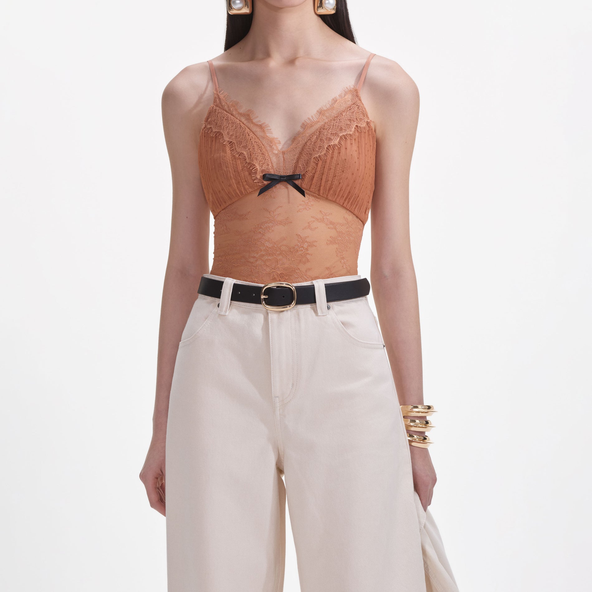 A close up of a woman wearing the Cream Denim Jeans