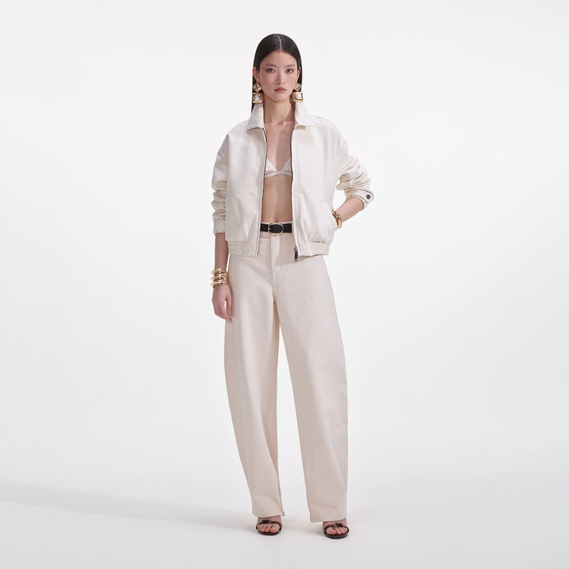 A close up of a woman wearing the Cream Lightweight Denim Jacket