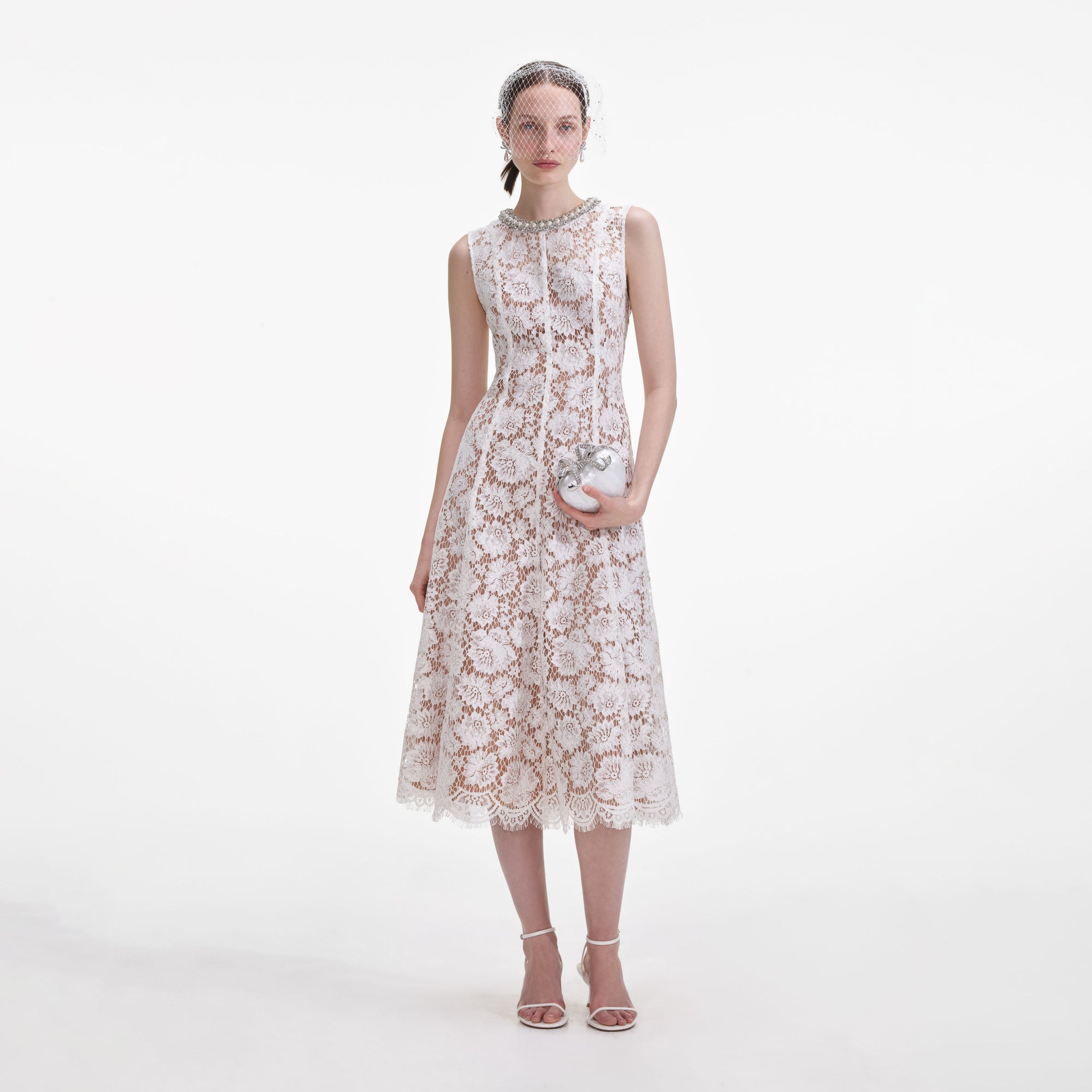 Front view of a woman wearing the White Fine Lace Pearl Midi Dress