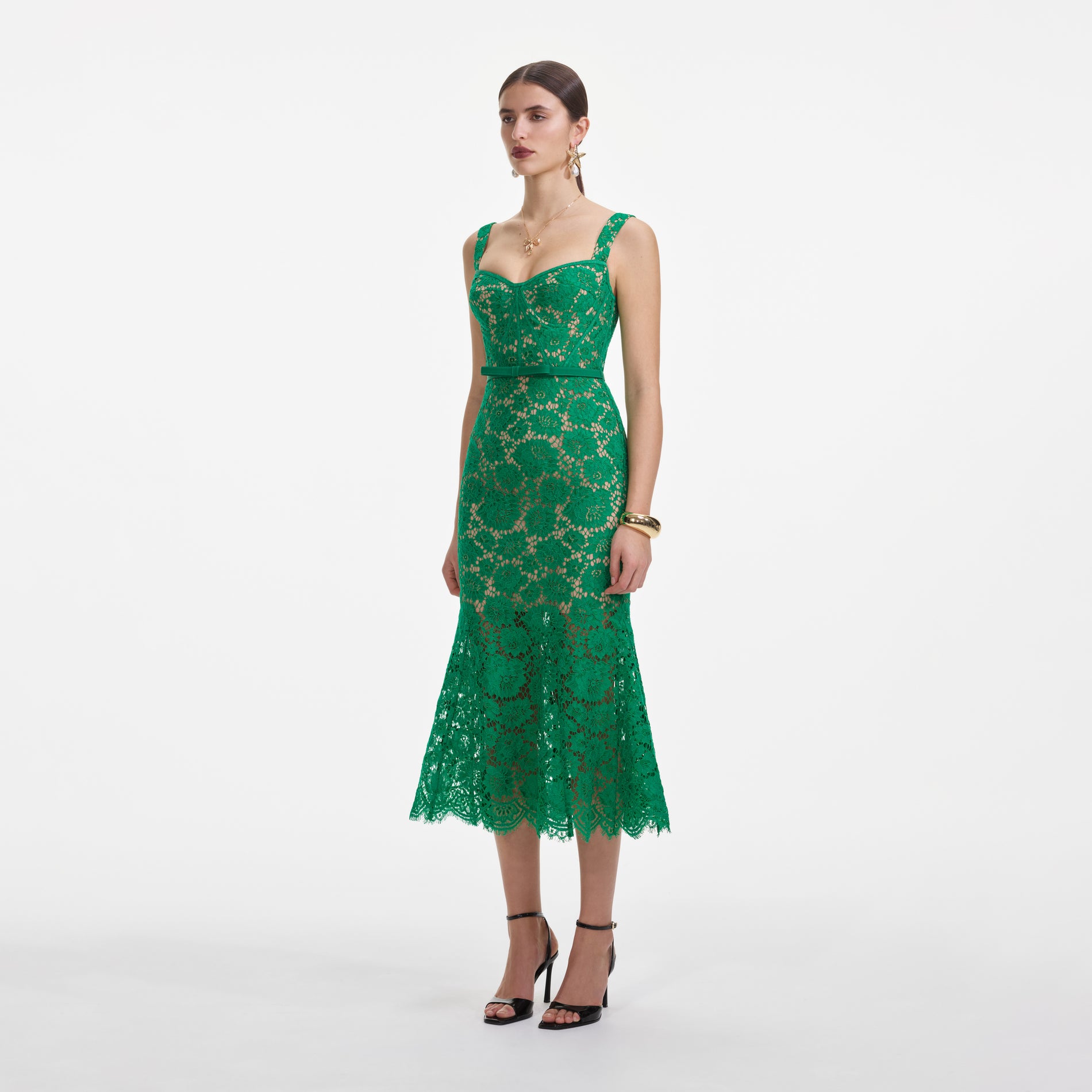 Side view of a woman wearing the Green Fine Lace Midi Dress