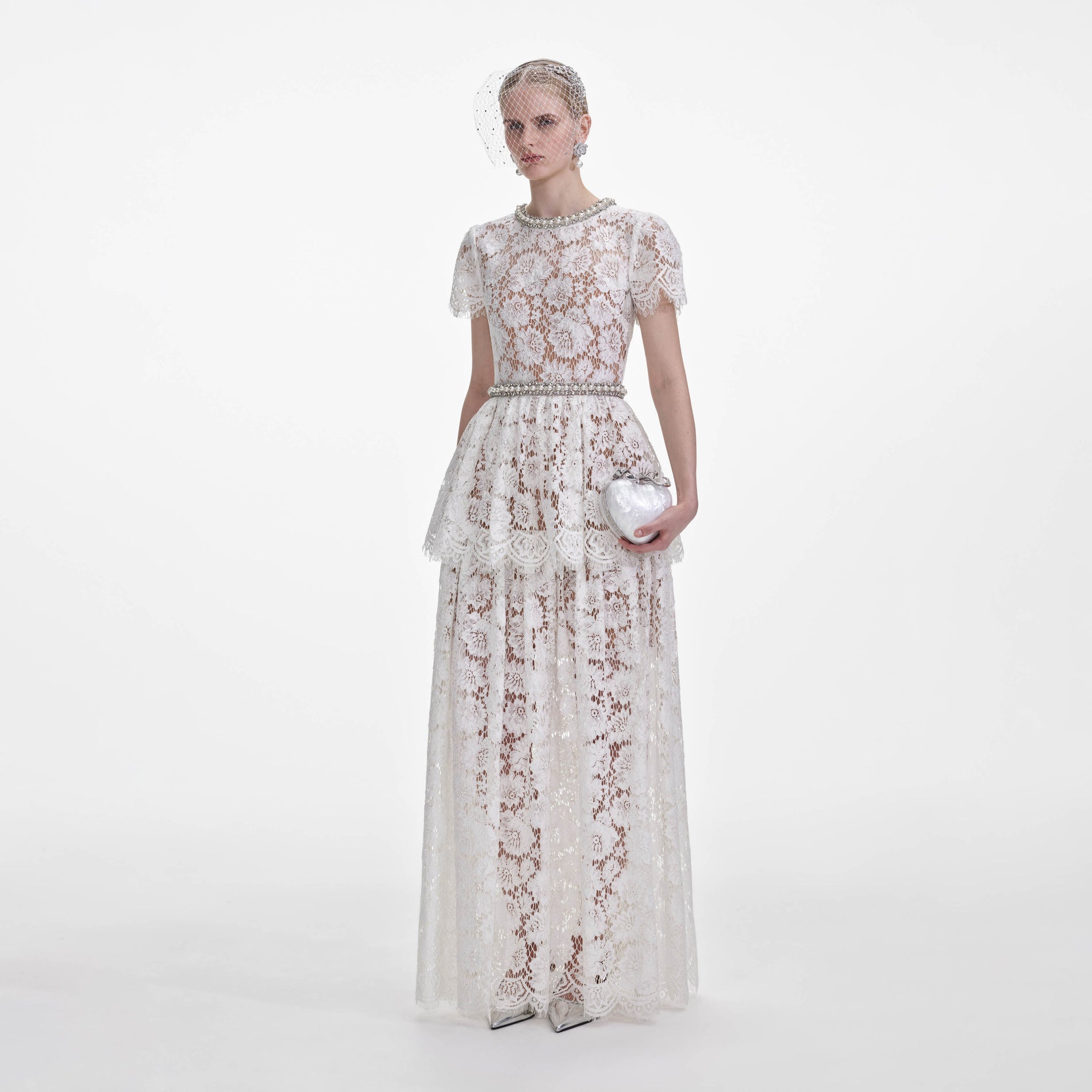 Side view of a woman wearing the White Lace Tiered Maxi Dress
