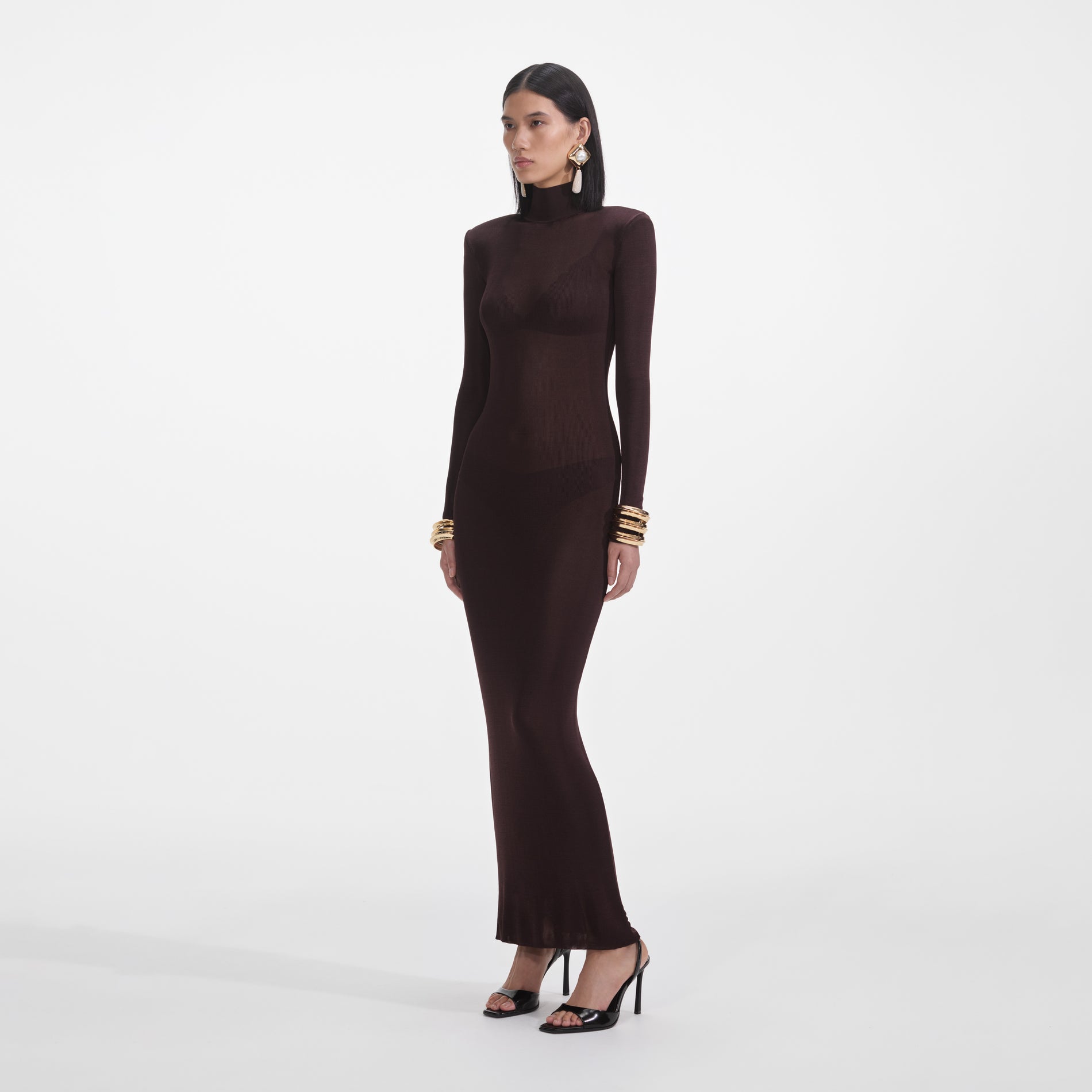 Side view of a woman wearing the Brown Viscose Knit Maxi Dress