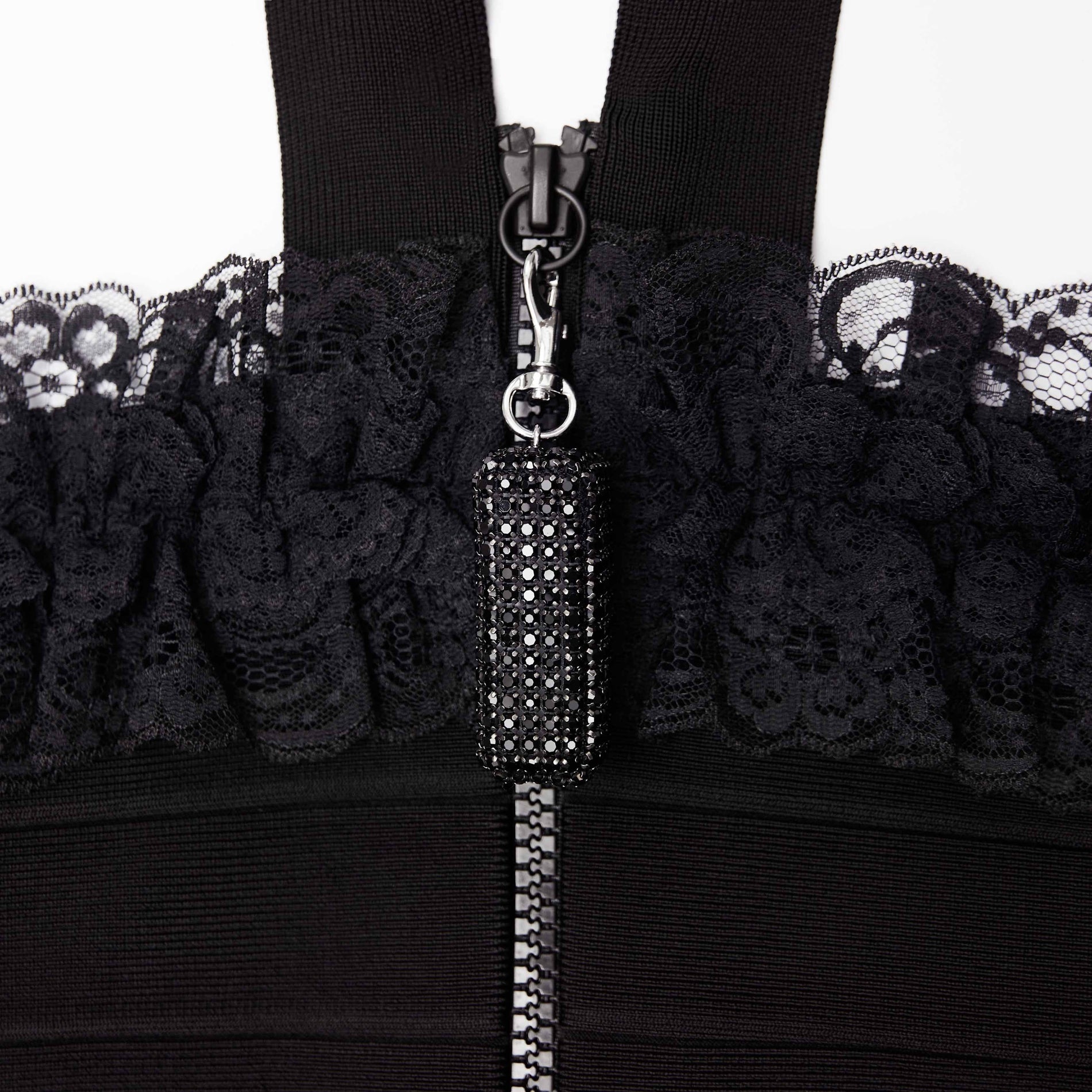 A close up of the fabric for the Black Knit Zip Ruffle Midi Dress