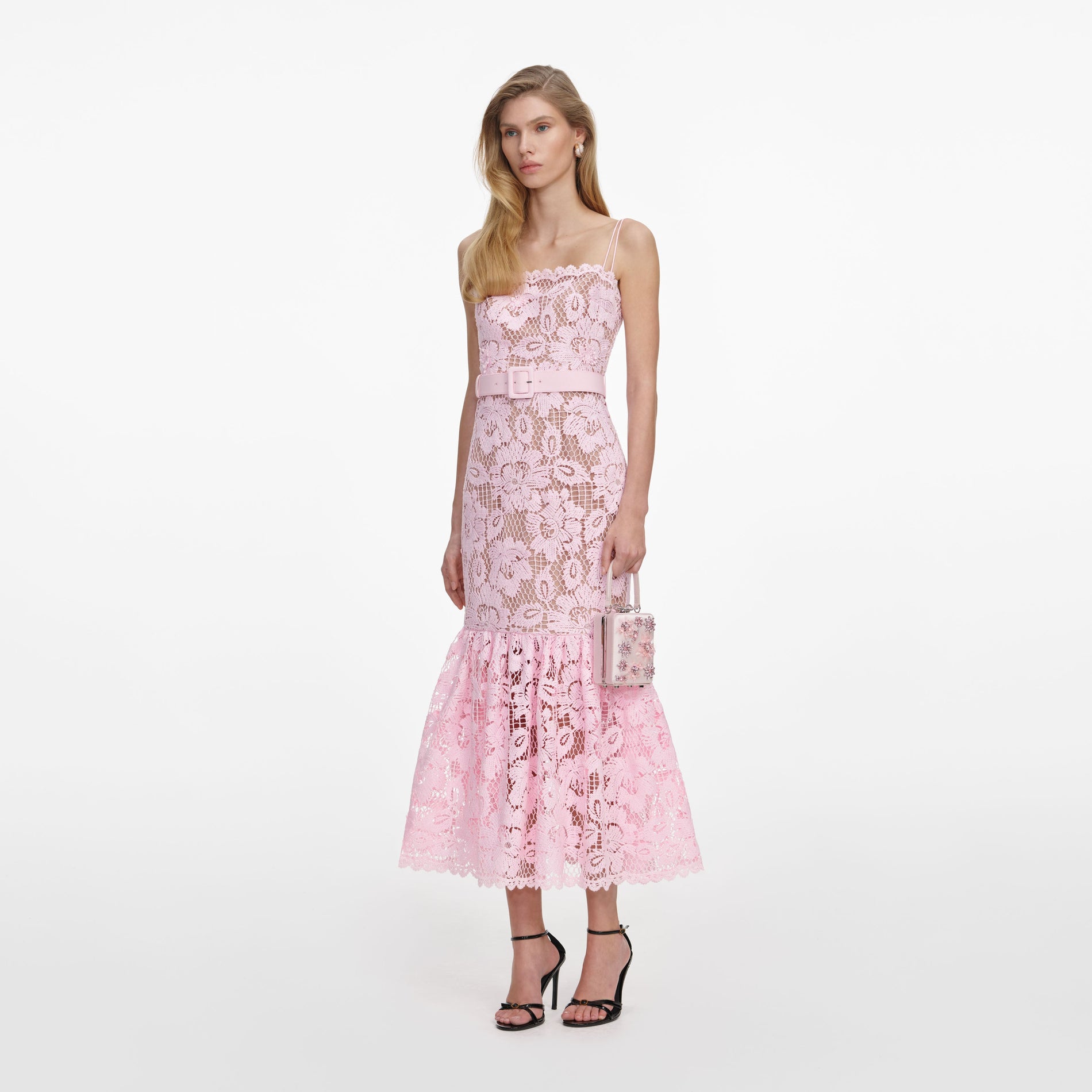 Side view of a woman wearing the Pink Crochet Lace Midi Dress
