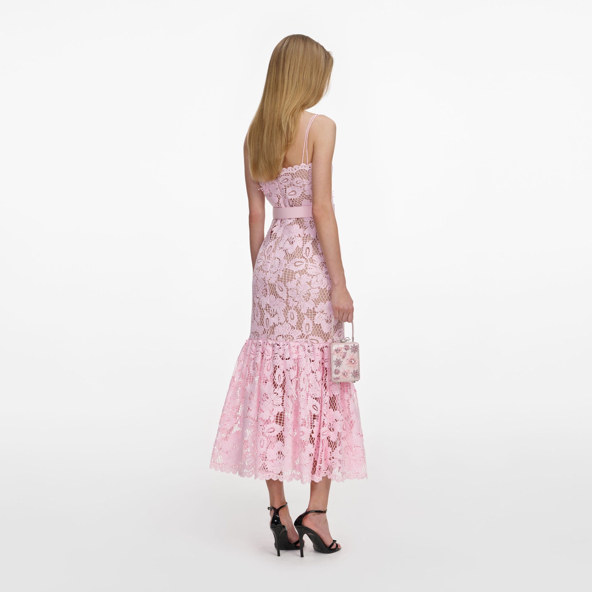 Back view of a woman wearing the Pink Crochet Lace Midi Dress