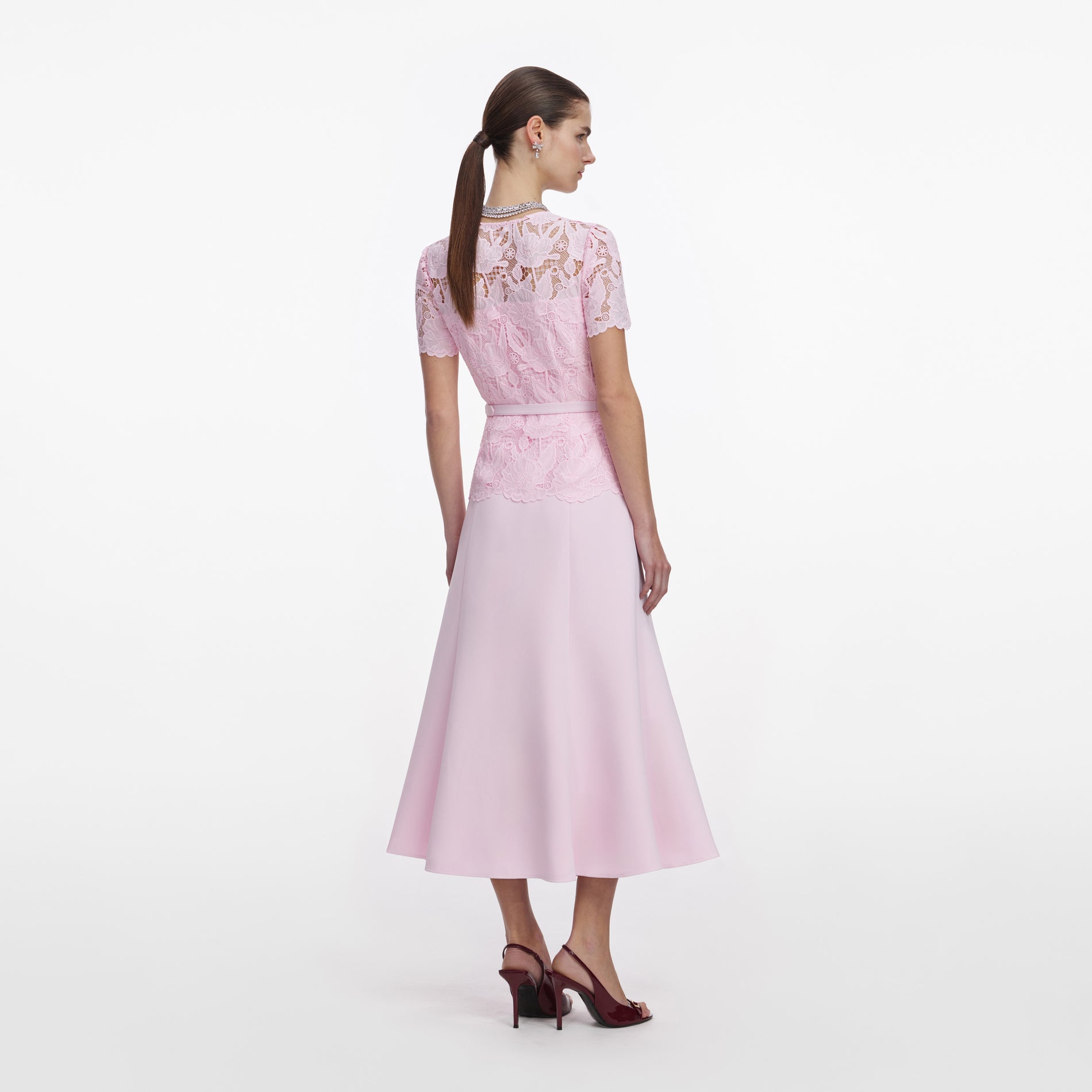 Back view of a woman wearing the Pink Lace Crepe Midi Dress