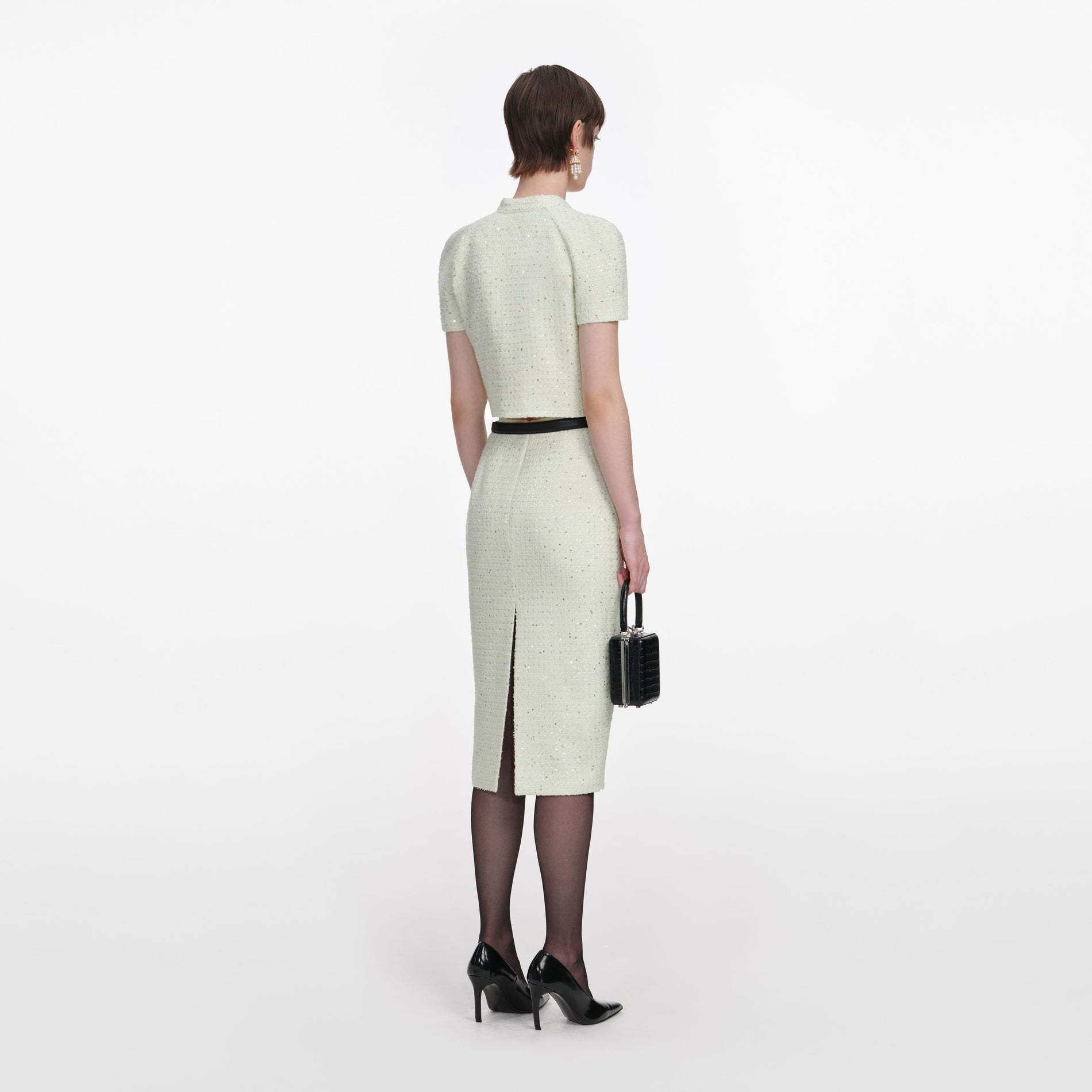 Back view of a woman wearing the Lime Boucle Top