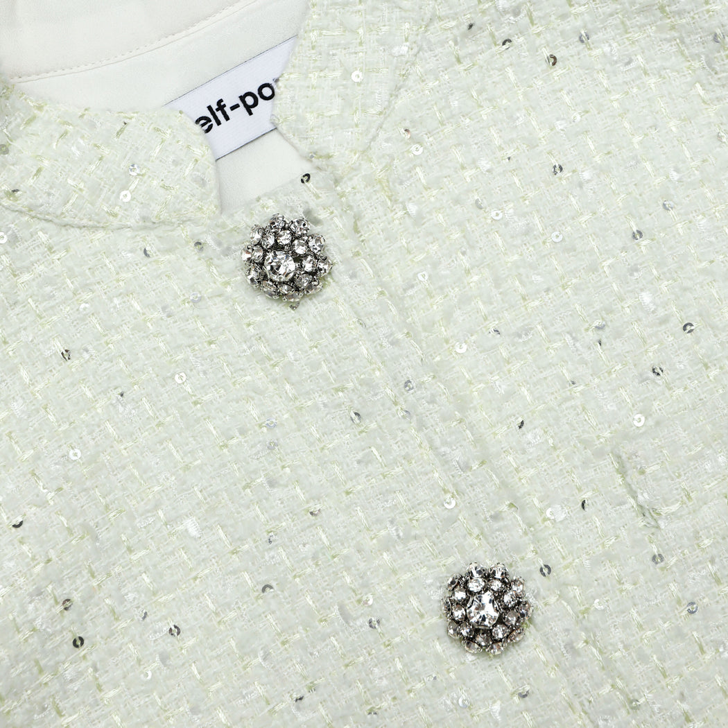 A close up of the fabric for the Lime Boucle Top