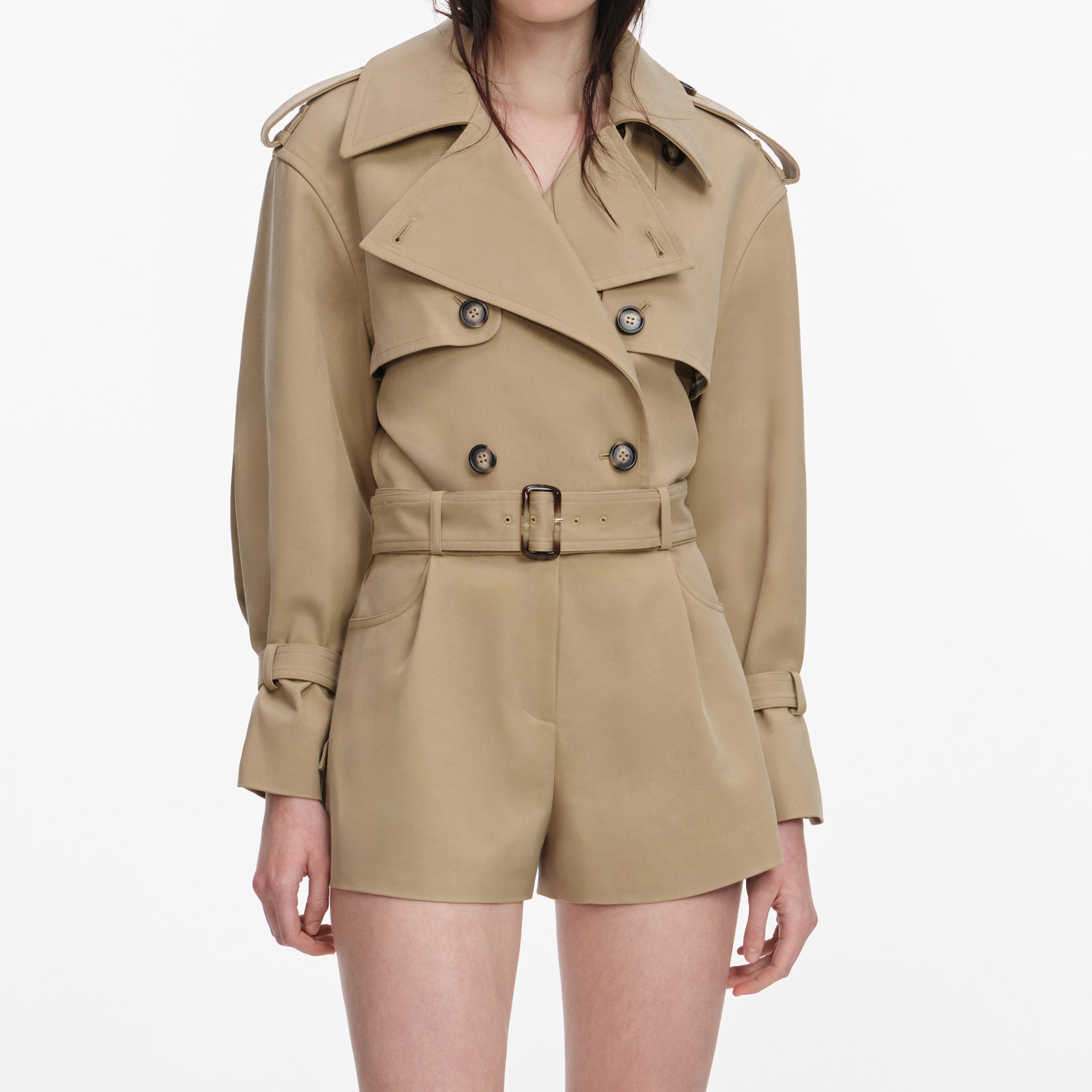 A close up of a woman wearing the Beige Cotton Playsuit