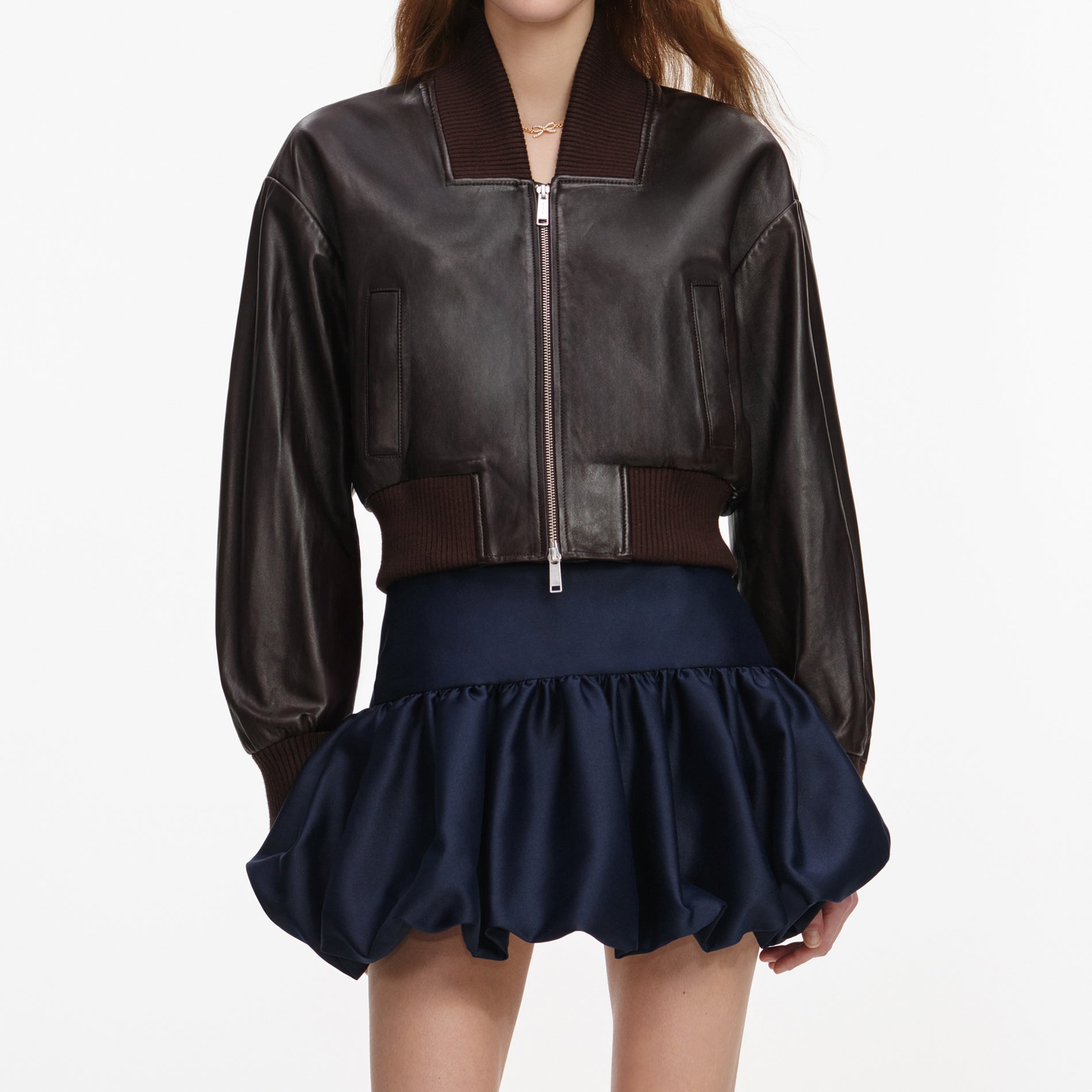 A close up of a woman wearing the Brown Leather Jacket