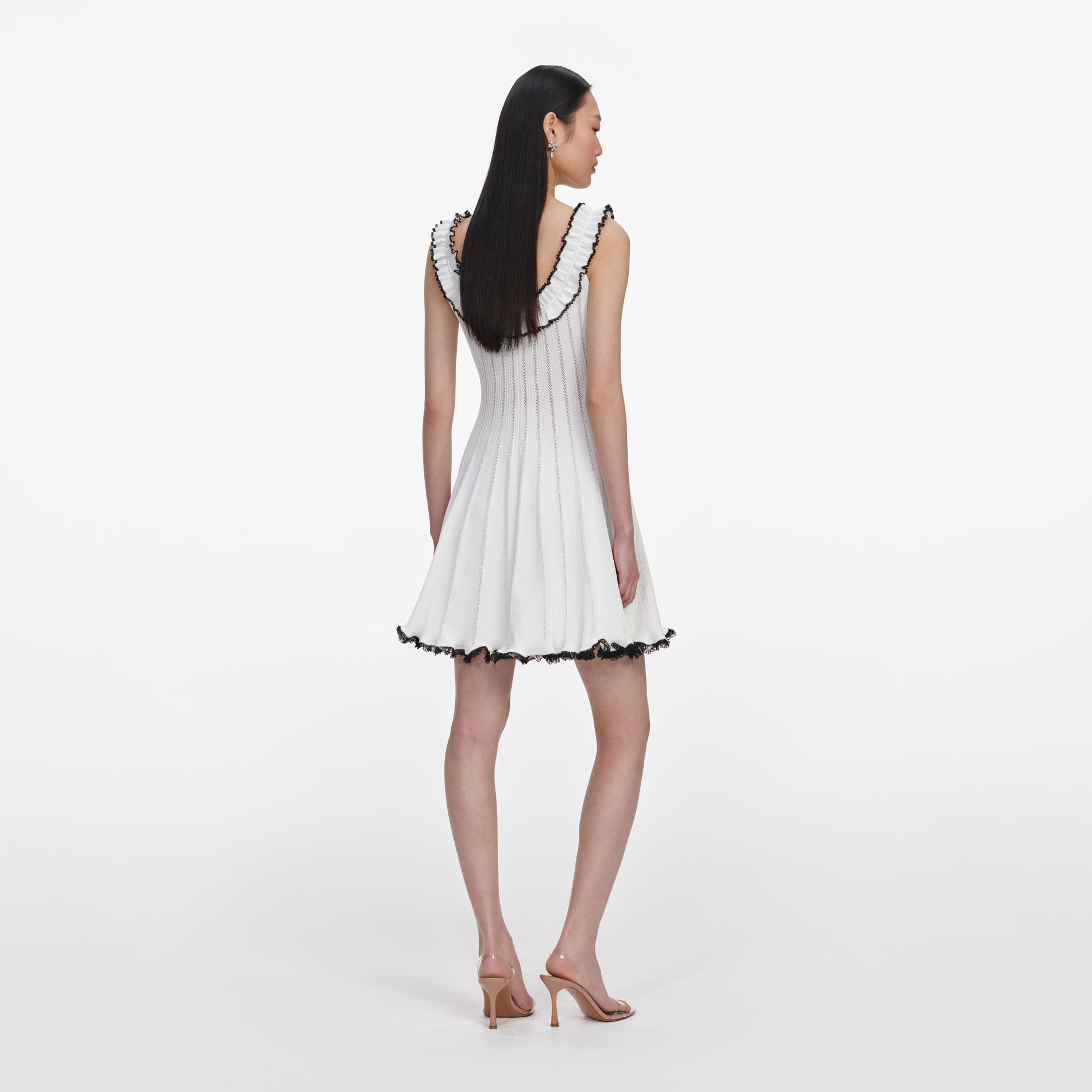 Back view of a woman wearing the White Contrast Trim Knit Mini Dress