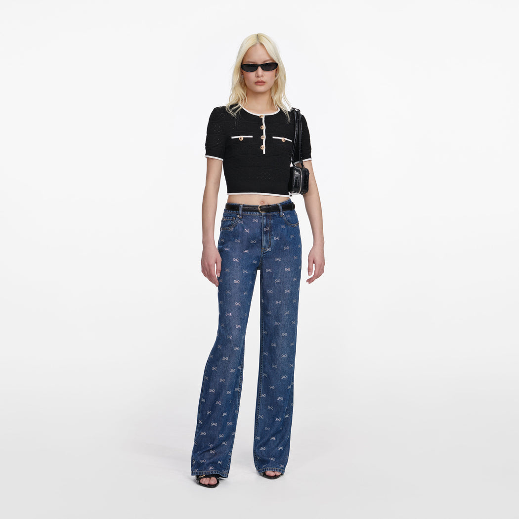 Front view of a woman wearing the Black Pointelle Knit Top