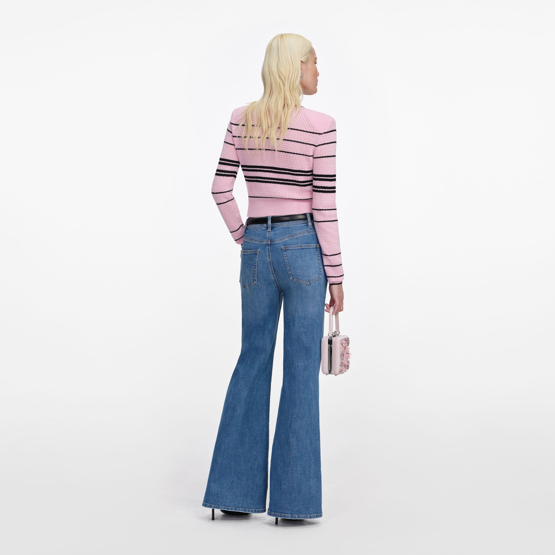 Back view of a woman wearing the Pink Stripe Cardigan