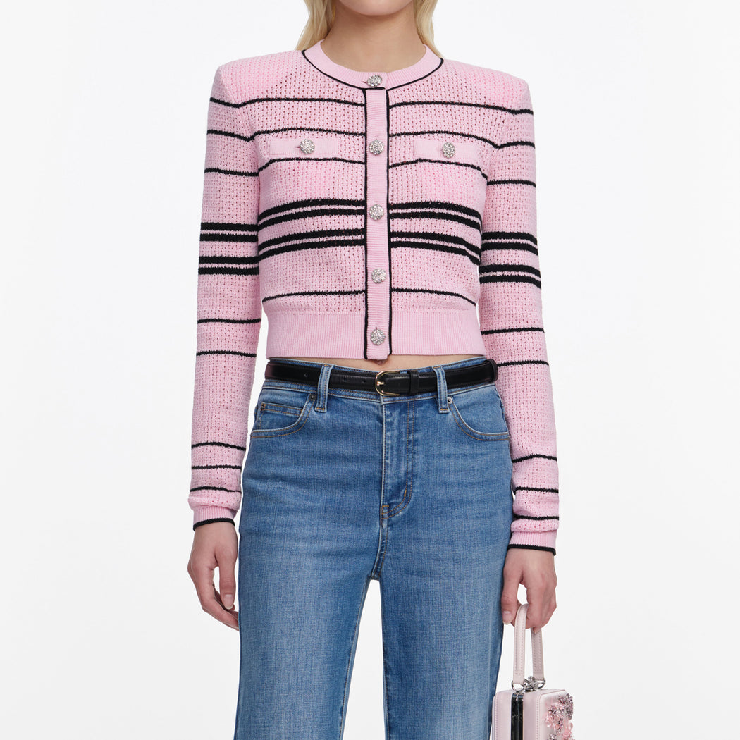 A close up of a woman wearing the Pink Stripe Cardigan