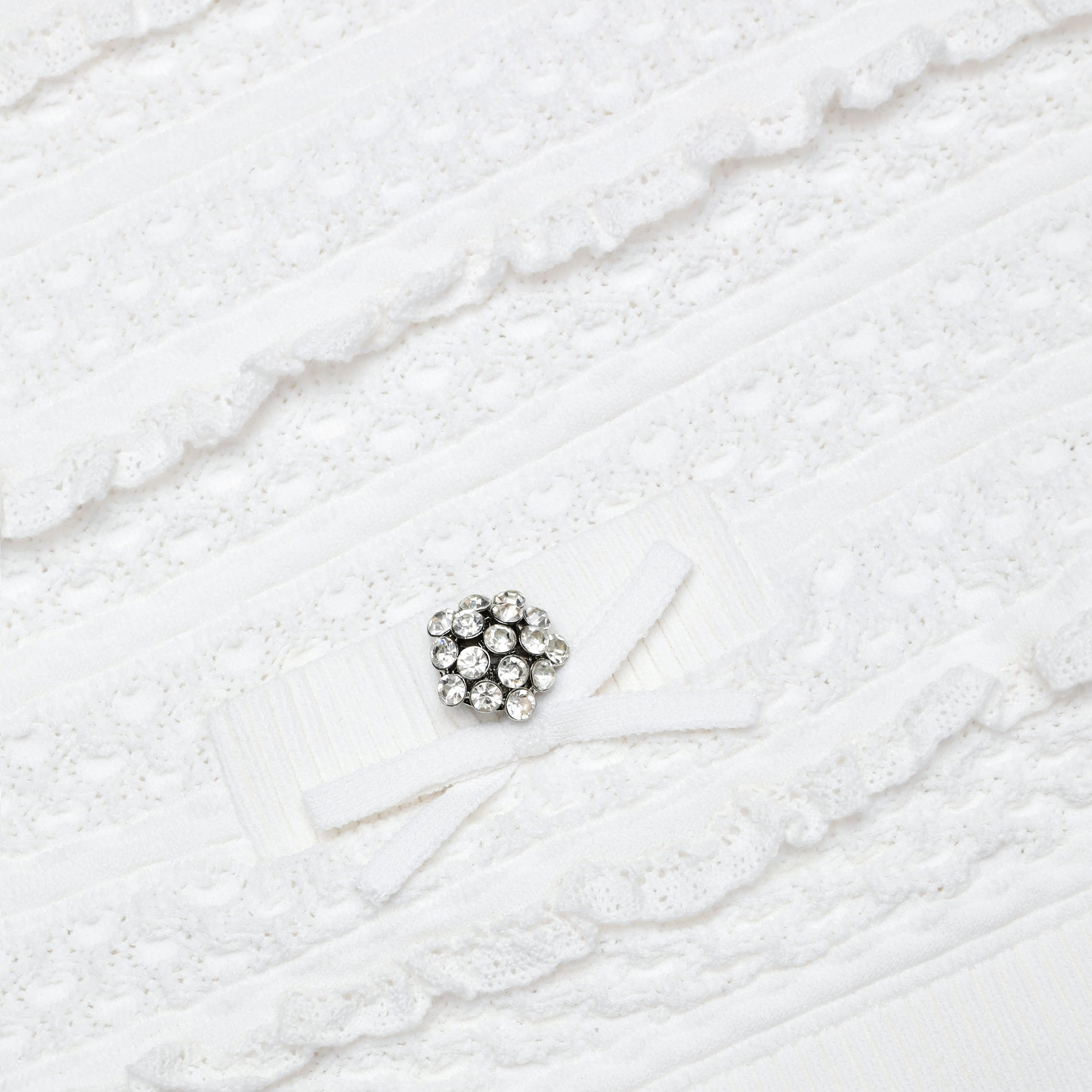 A close up of the fabric for the White Pointelle Knit Top