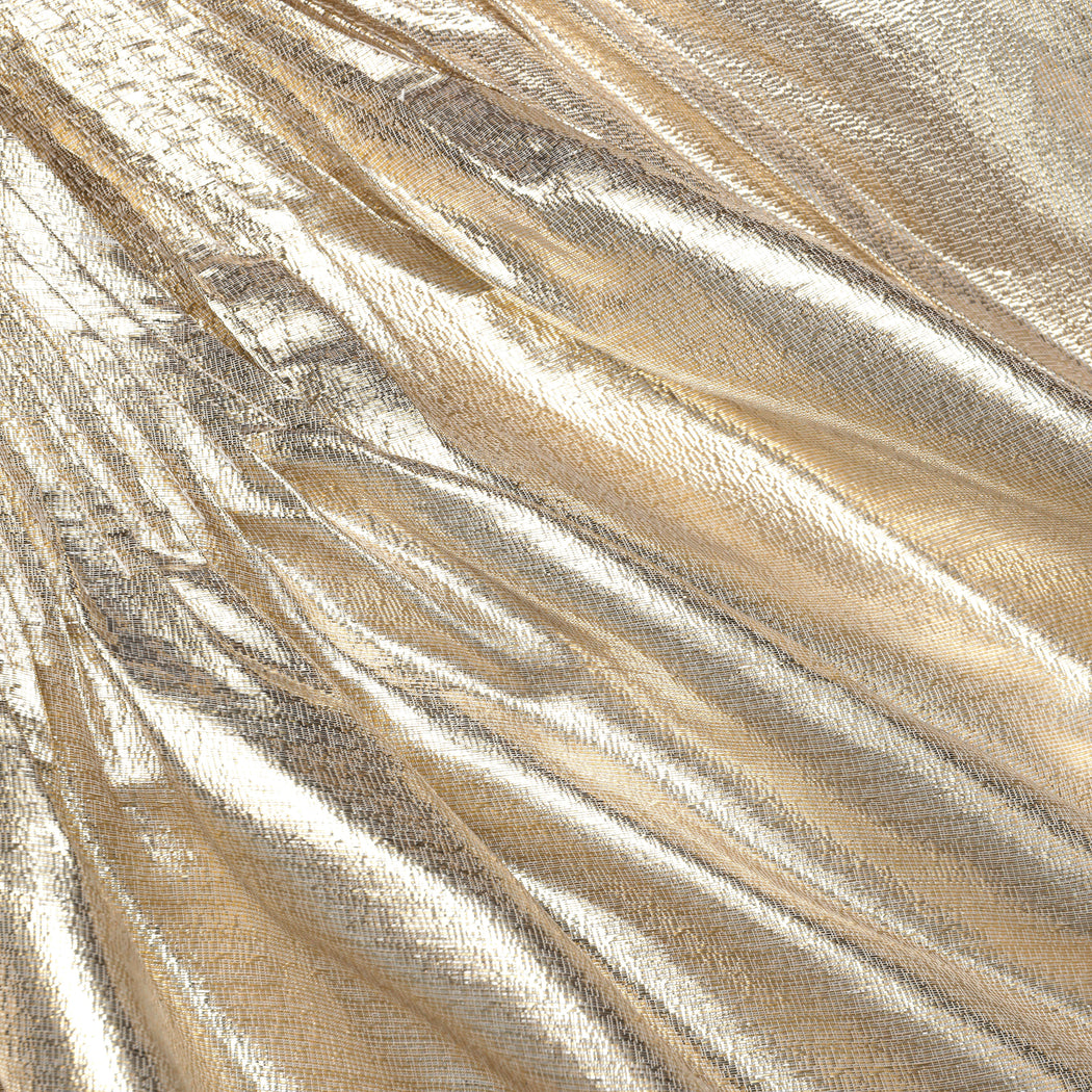Side view of a woman wearing the Gold Metallic Mini Skirt