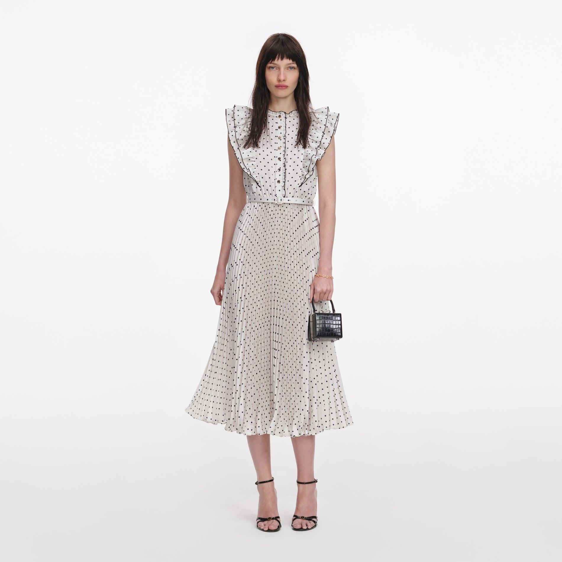 Front view of a woman wearing the Cream Ramie Polka Dot Midi Dress