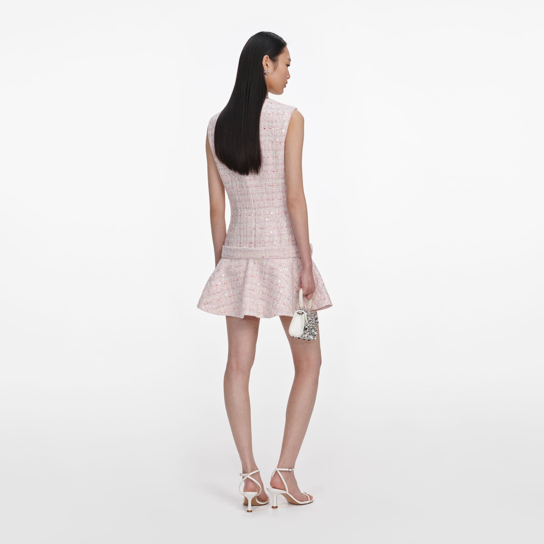 Back view of a woman wearing the Pink Sequin Boucle Belted Mini Dress