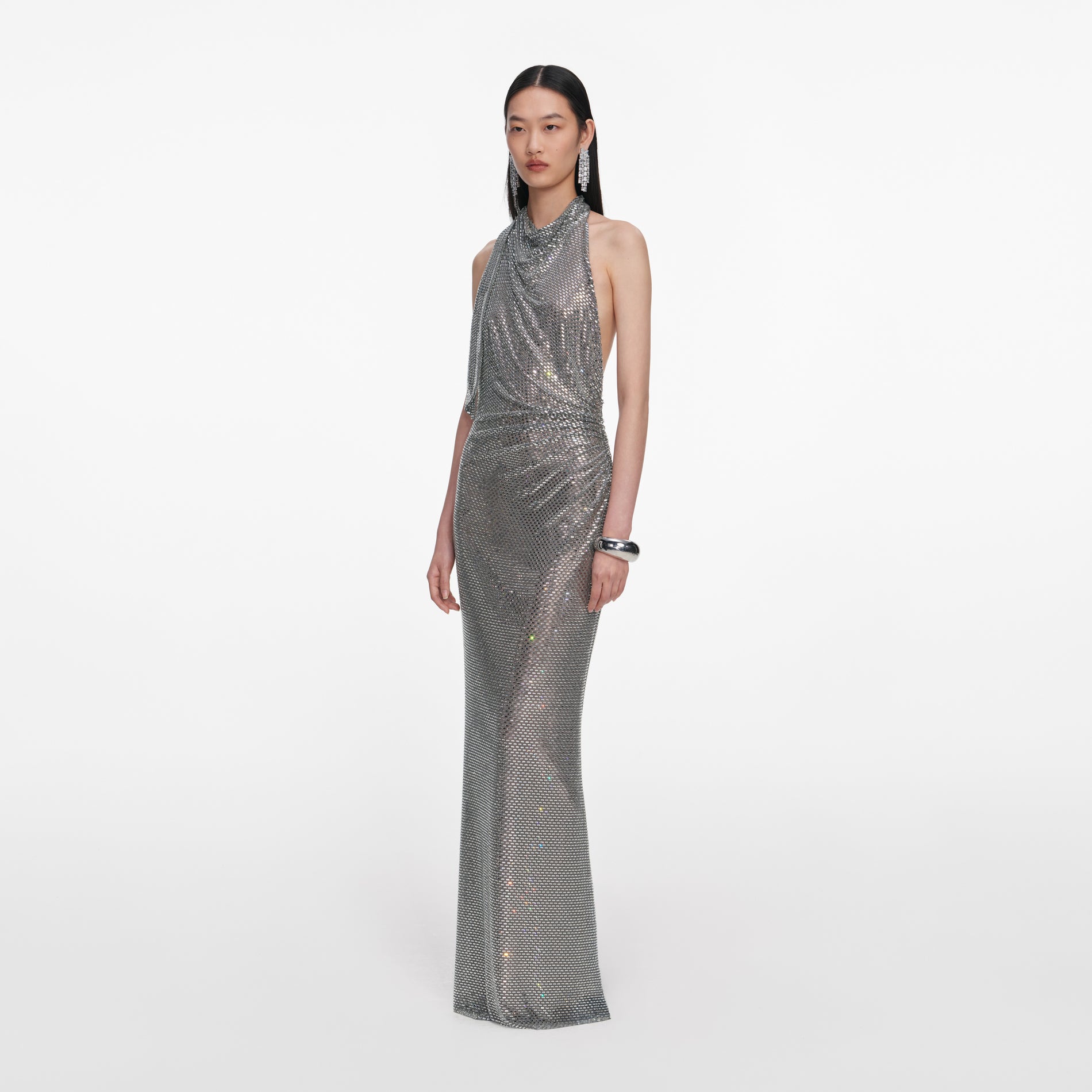 Side view of a woman wearing the Grey Rhinestone Drape Maxi Dress
