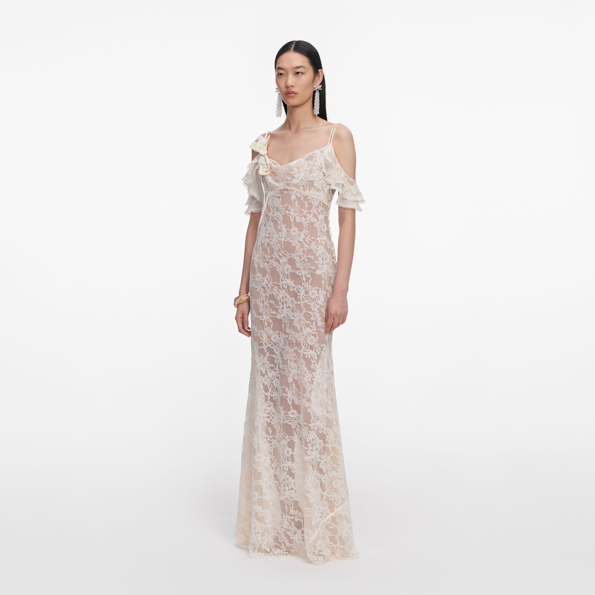 Side view of a woman wearing the Cream Lace Flower Maxi Dress