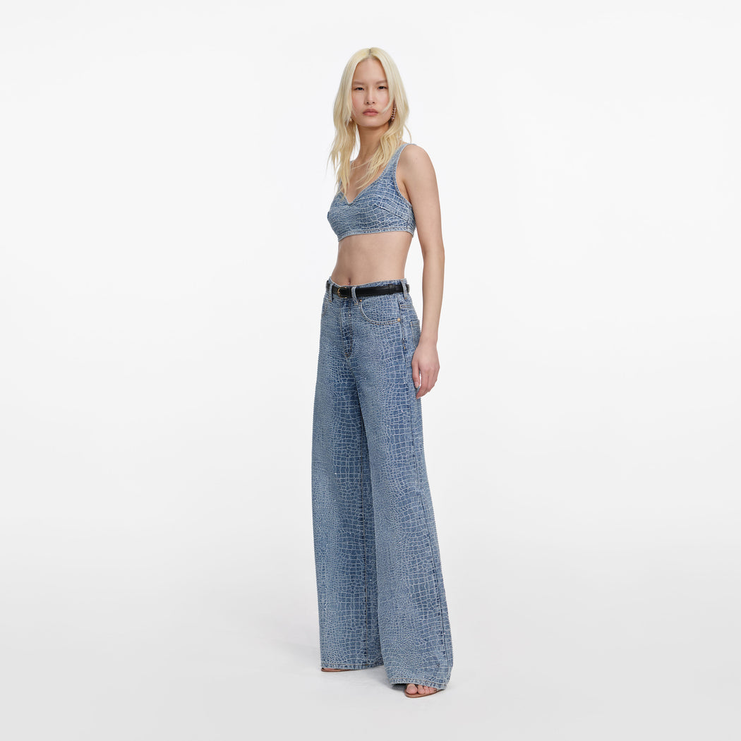 Side view of a woman wearing the Rhinestone Croc Effect Wide Leg Jeans
