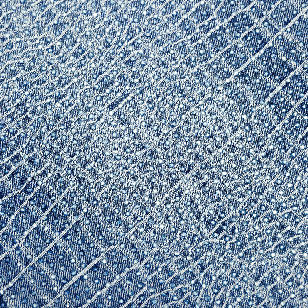 A close up of the fabric for the Rhinestone Croc Effect Wide Leg Jeans