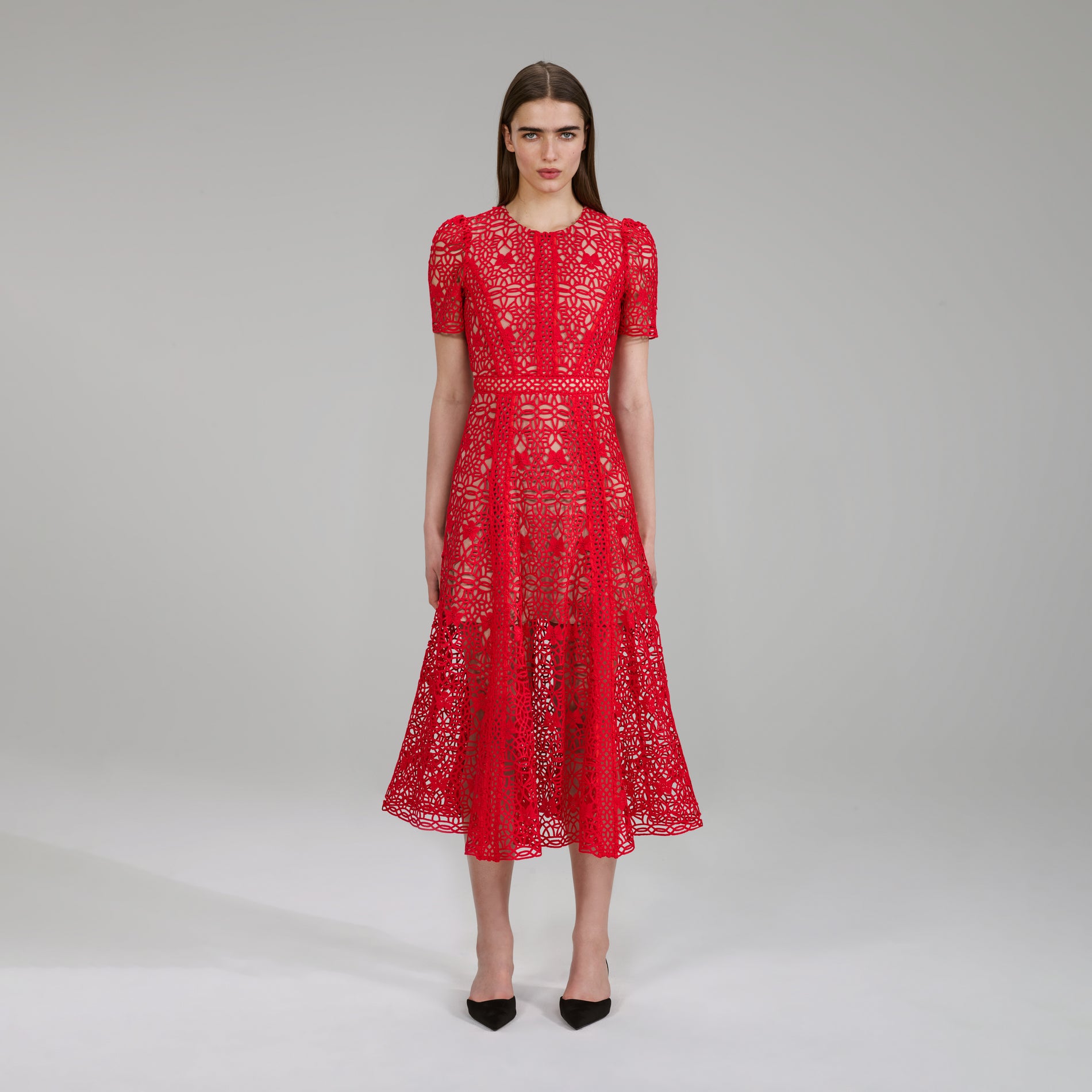 A woman wearing the Red Guipure Lace Midi Dress