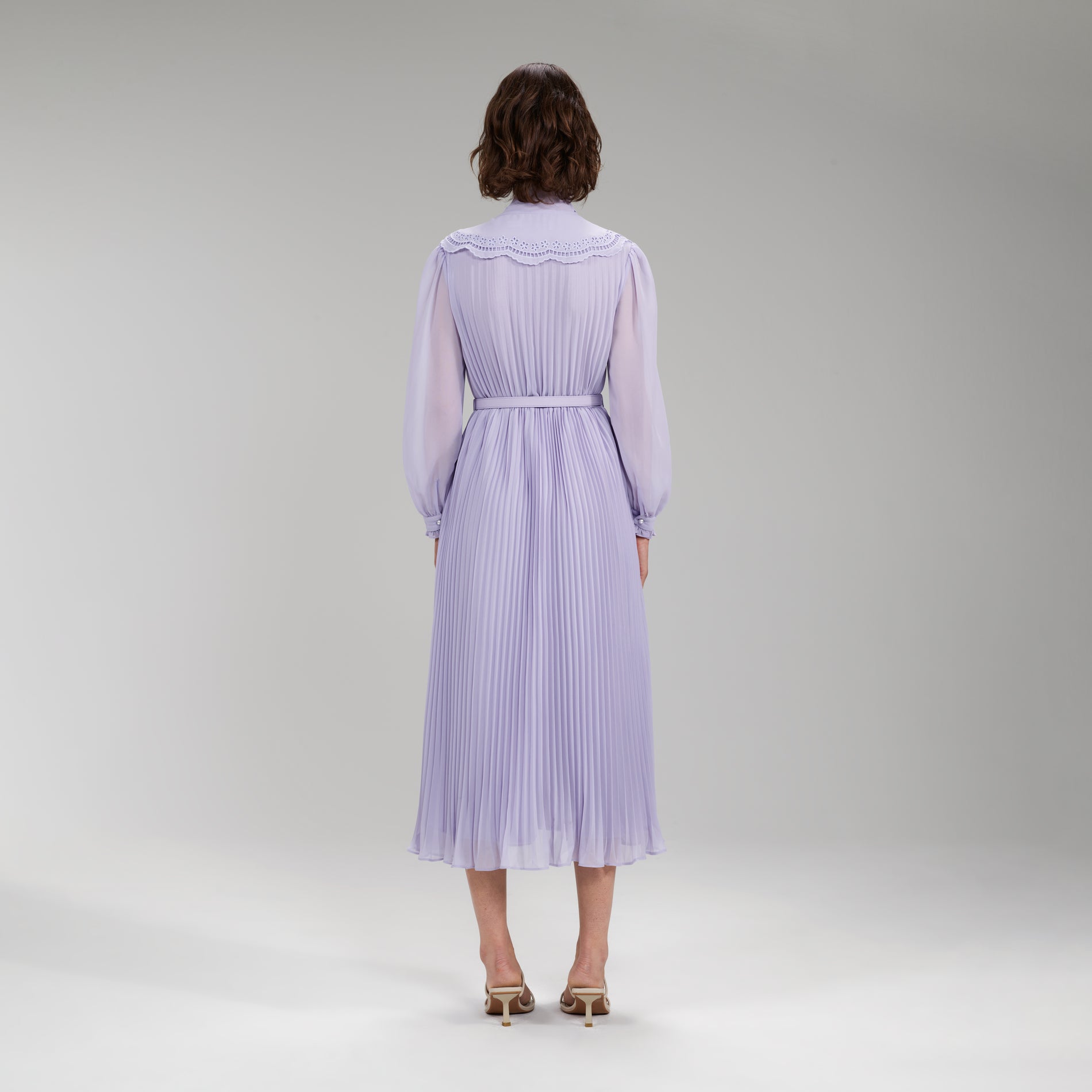 A woman wearing the Lilac Broderie Collar Chiffon Midi Dress