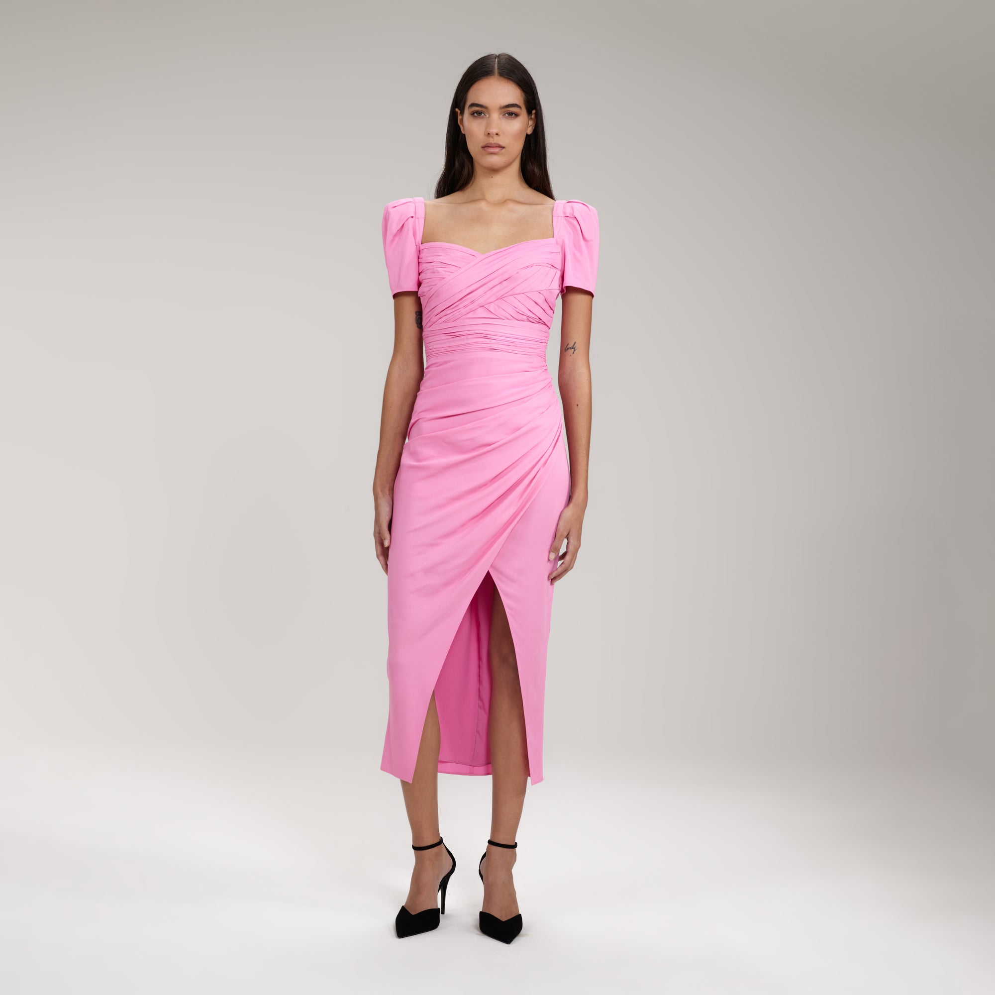 A woman wearing the Pink Iris Midi Dress