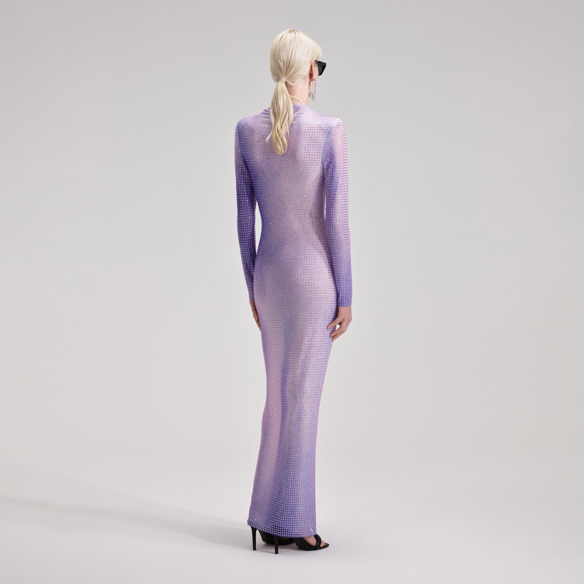 A woman wearing the Lilac Contour Print Maxi Dress
