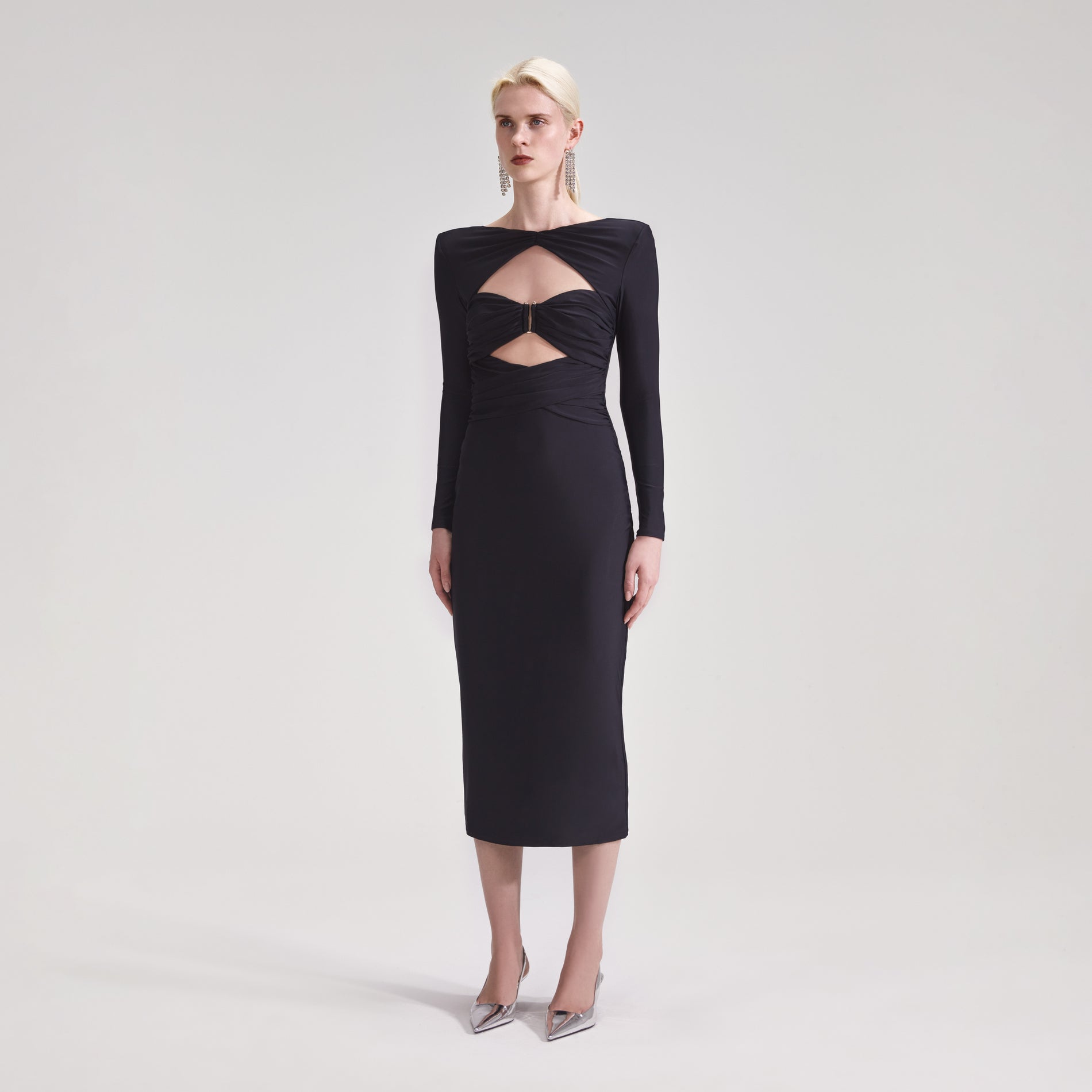 A woman wearing the Black Jersey Midi Dress