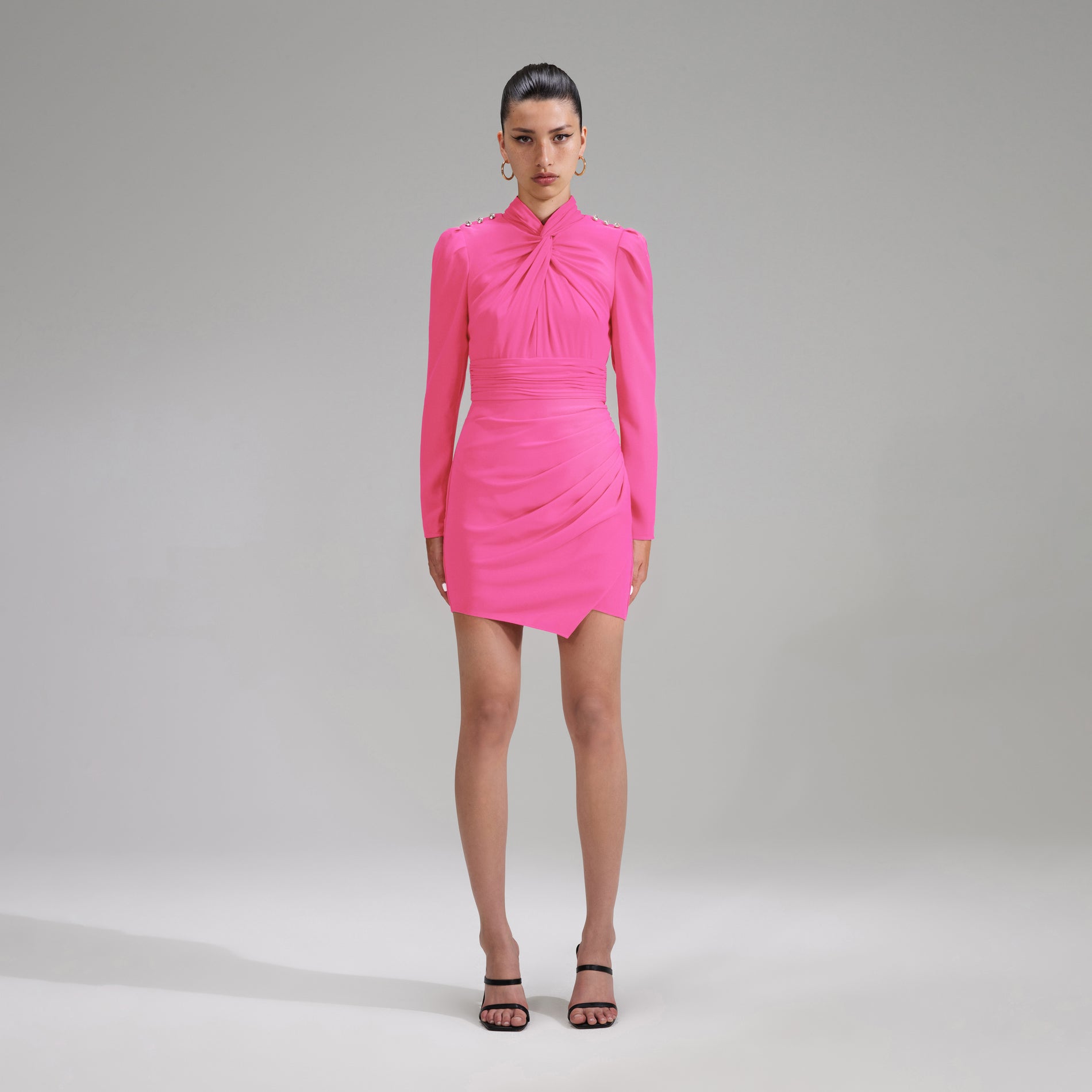 A woman wearing the Pink Stretch Crepe Twisted Collar Mini Dress