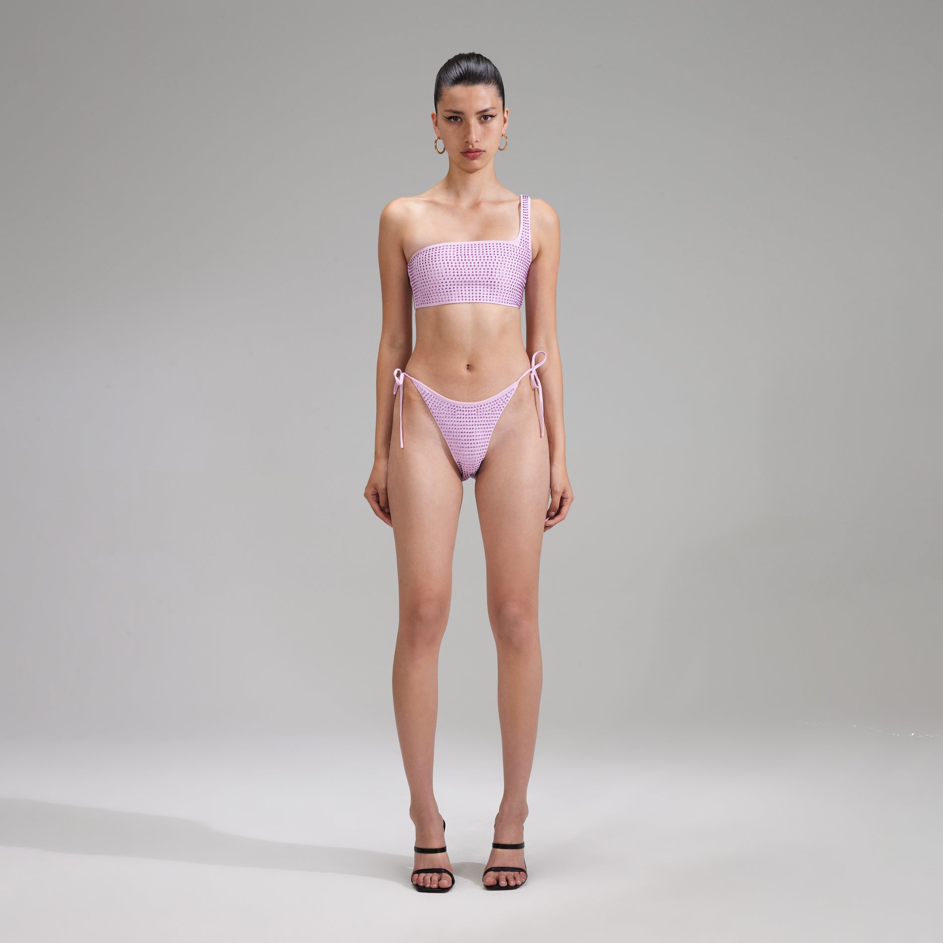 A woman wearing the Lilac Rhinestone Brazilian Bikini Briefs
