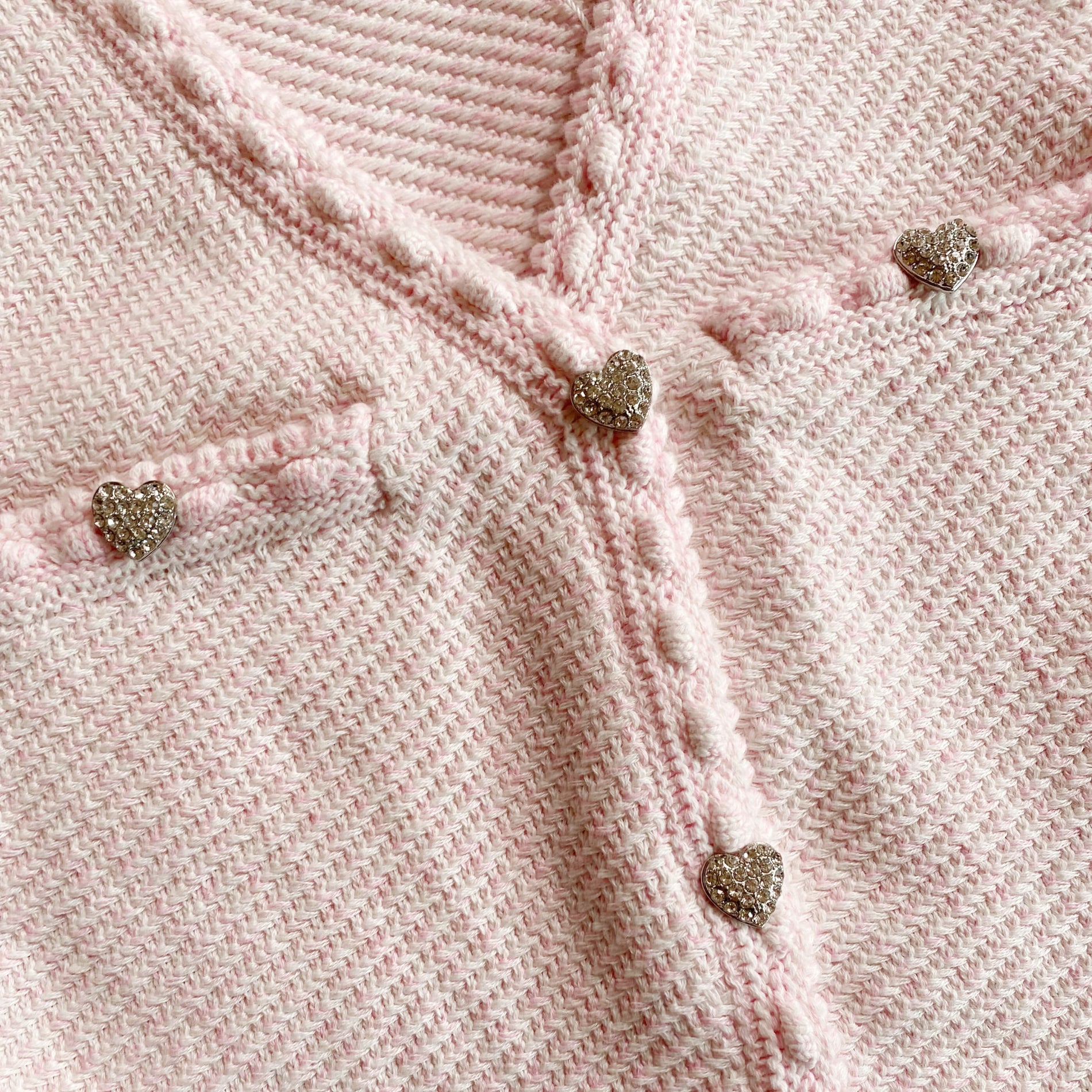A close up of the fabric for the Pink Knit Button Mini Dress