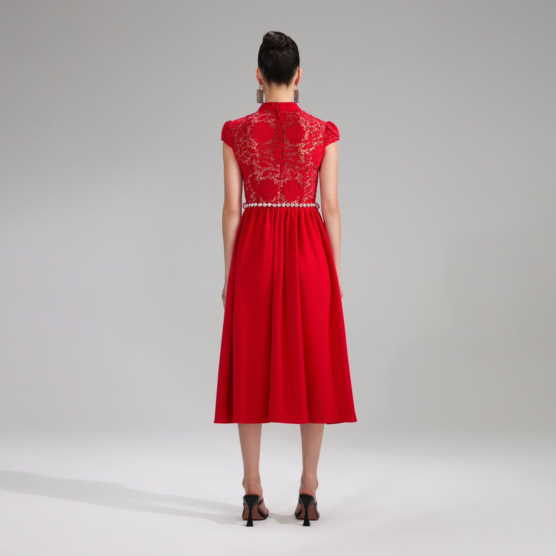 A woman wearing the Red Lace Cotton Midi Dress