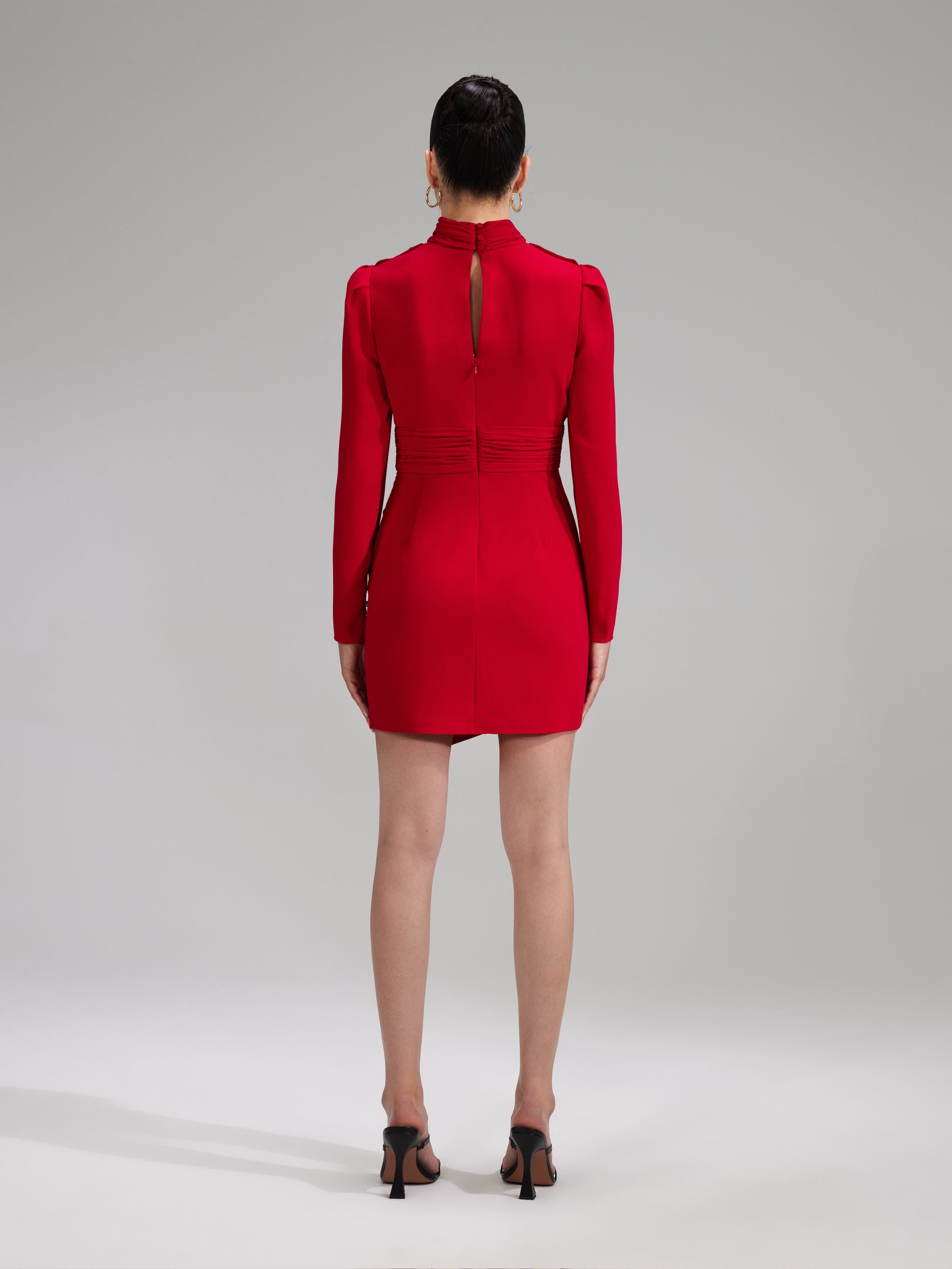 A woman wearing the Red Stretch Crepe Twisted Collar Mini Dress
