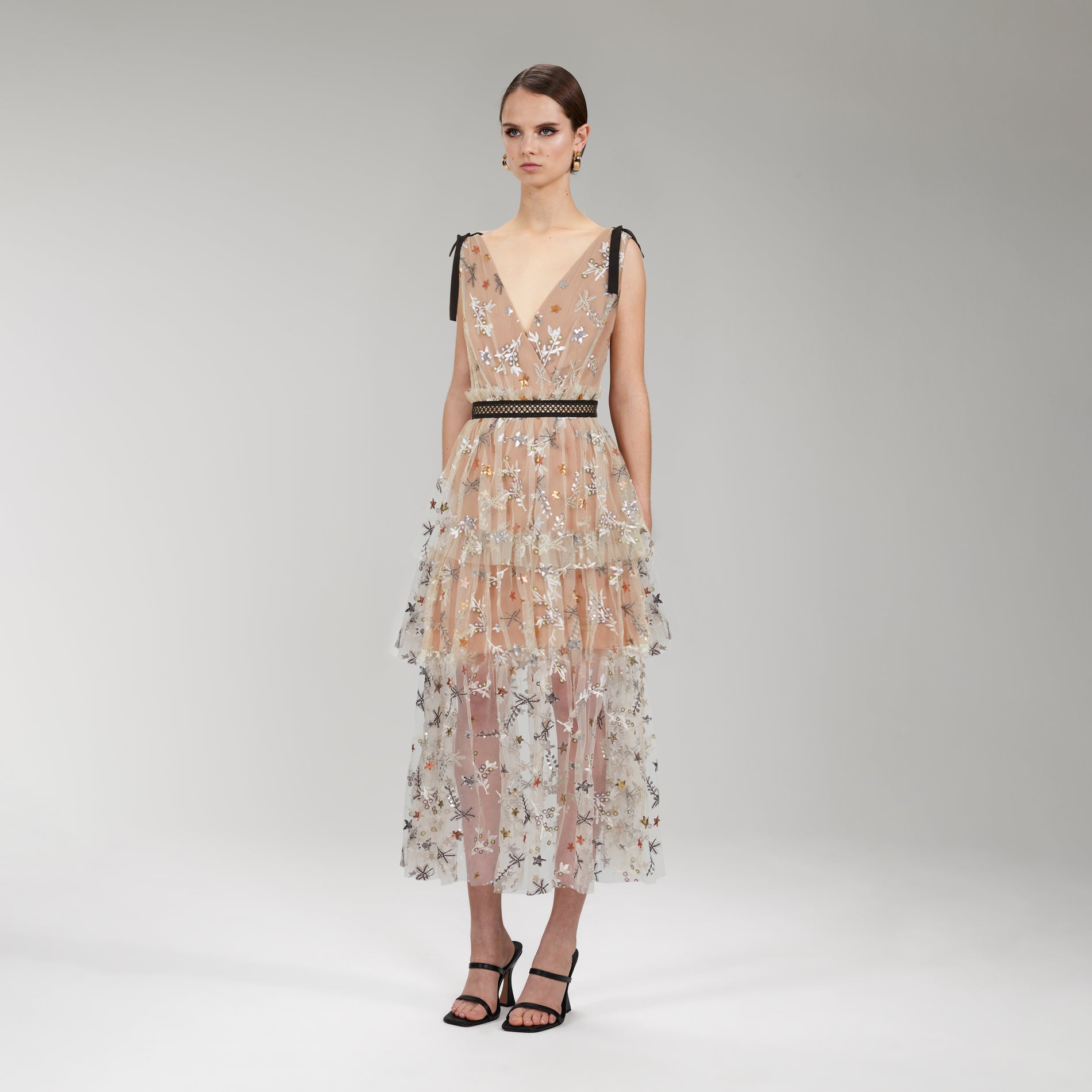 A woman wearing the Star Mesh Midi Dress